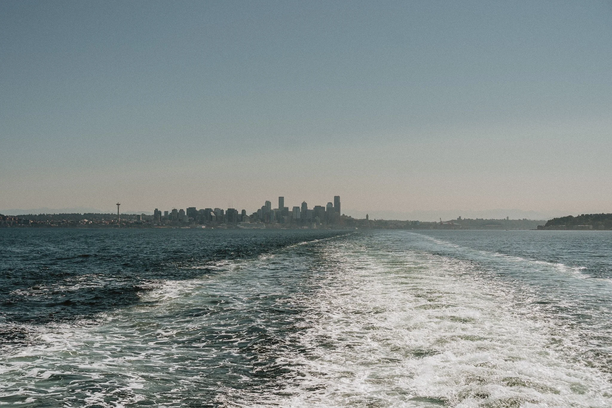 view of the Seattle Space Needle from a ferry