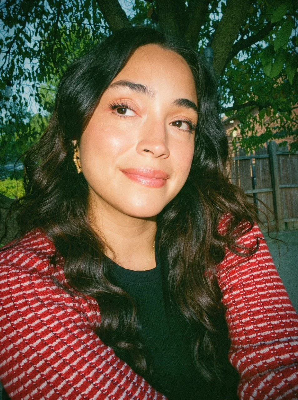 community strategist, dj and doula, smiling outdoors