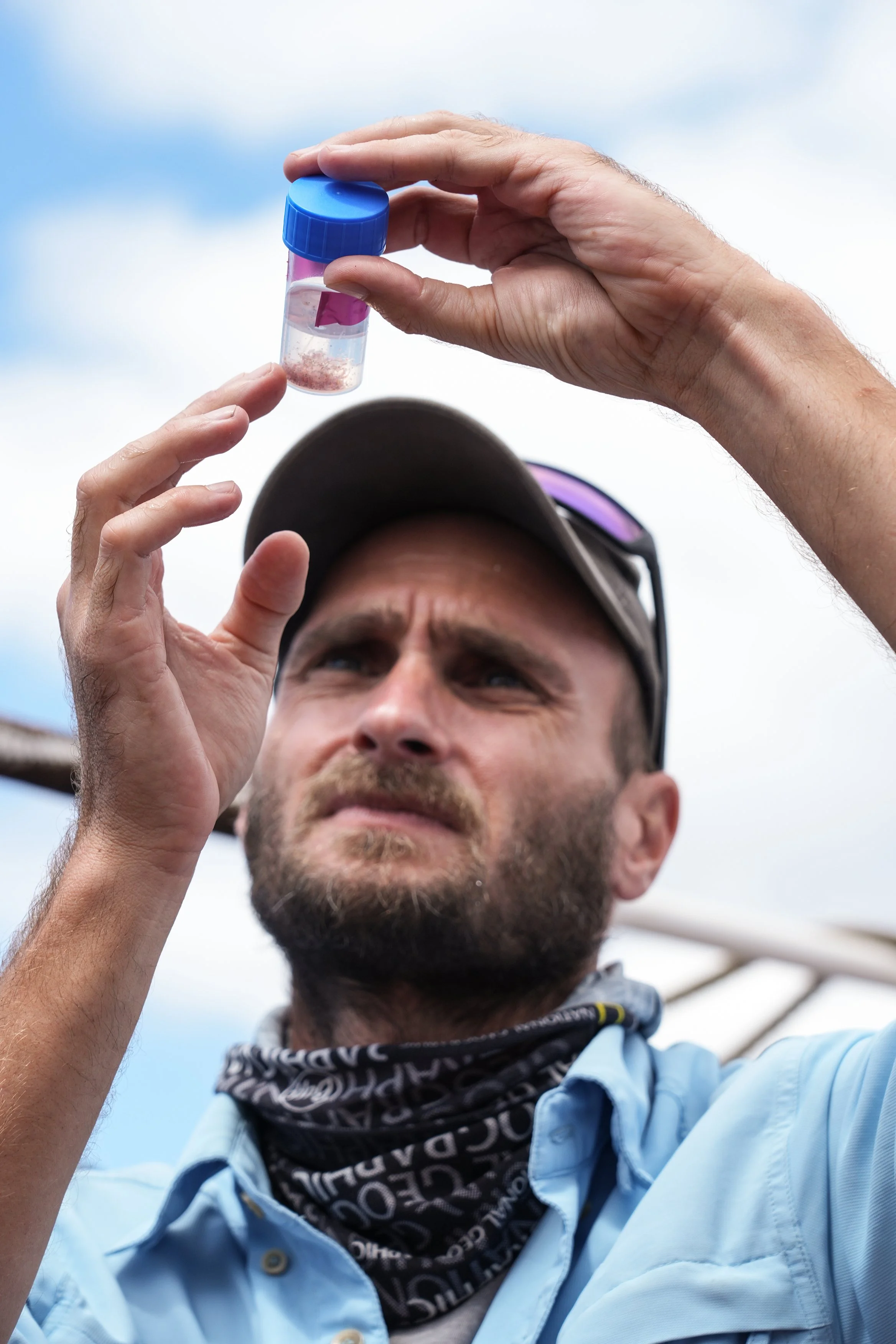 6 Cuen looking at sample in pot.jpg