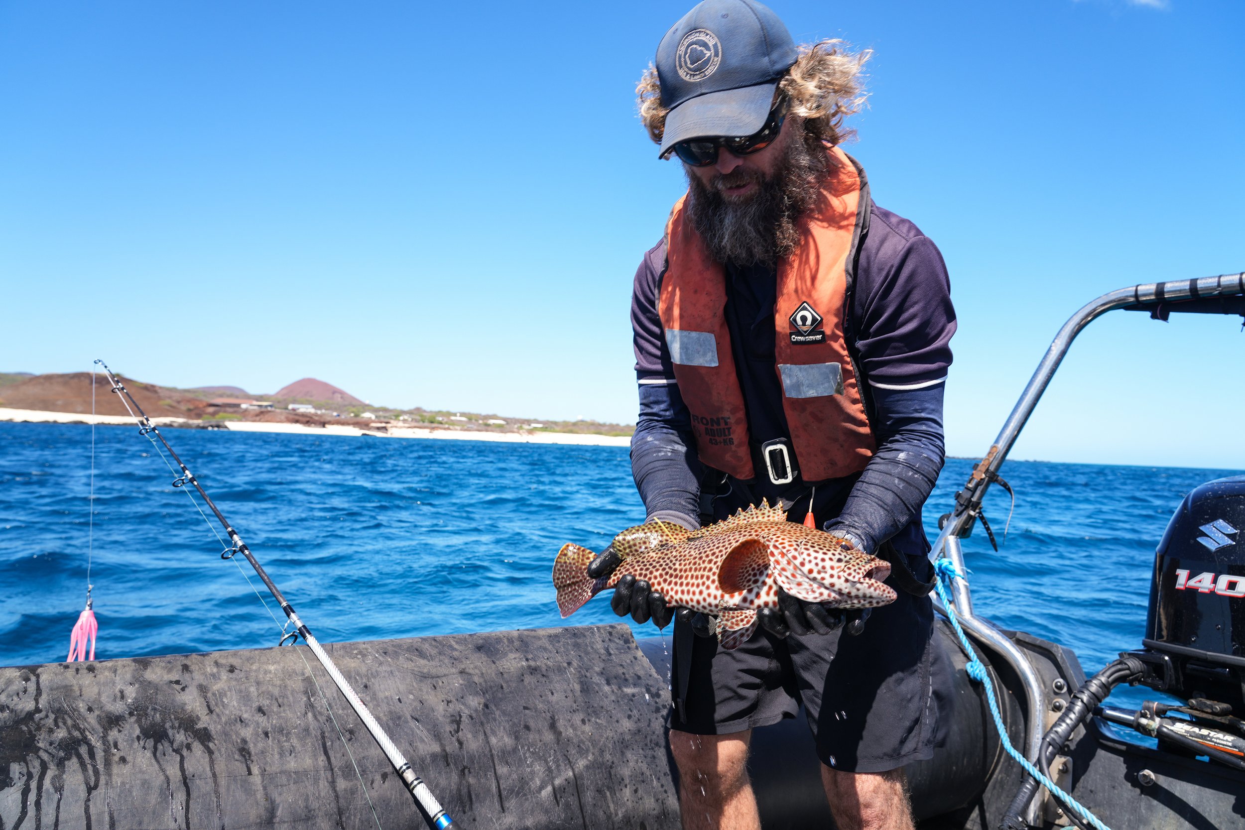9 Dan holding Grouper Mid shot.jpg