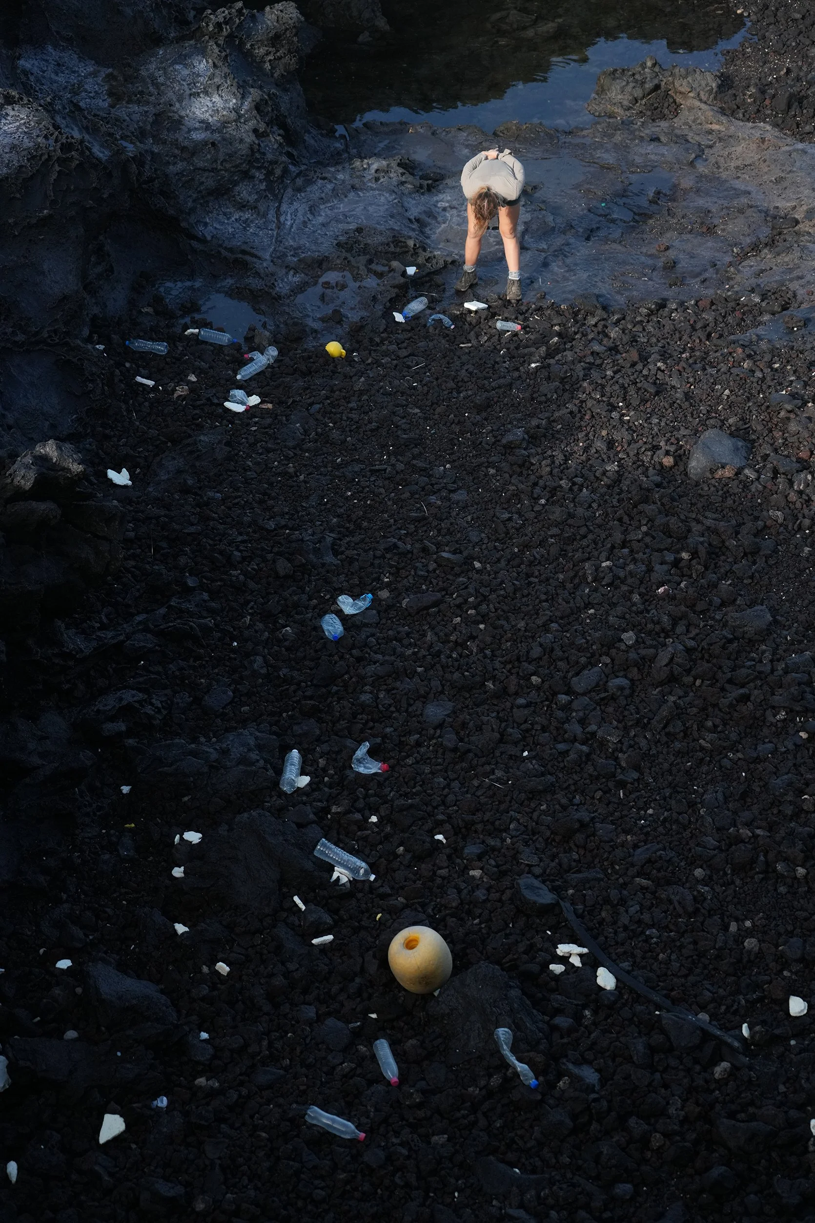 10 Hayley looking at plastic on beach.jpg