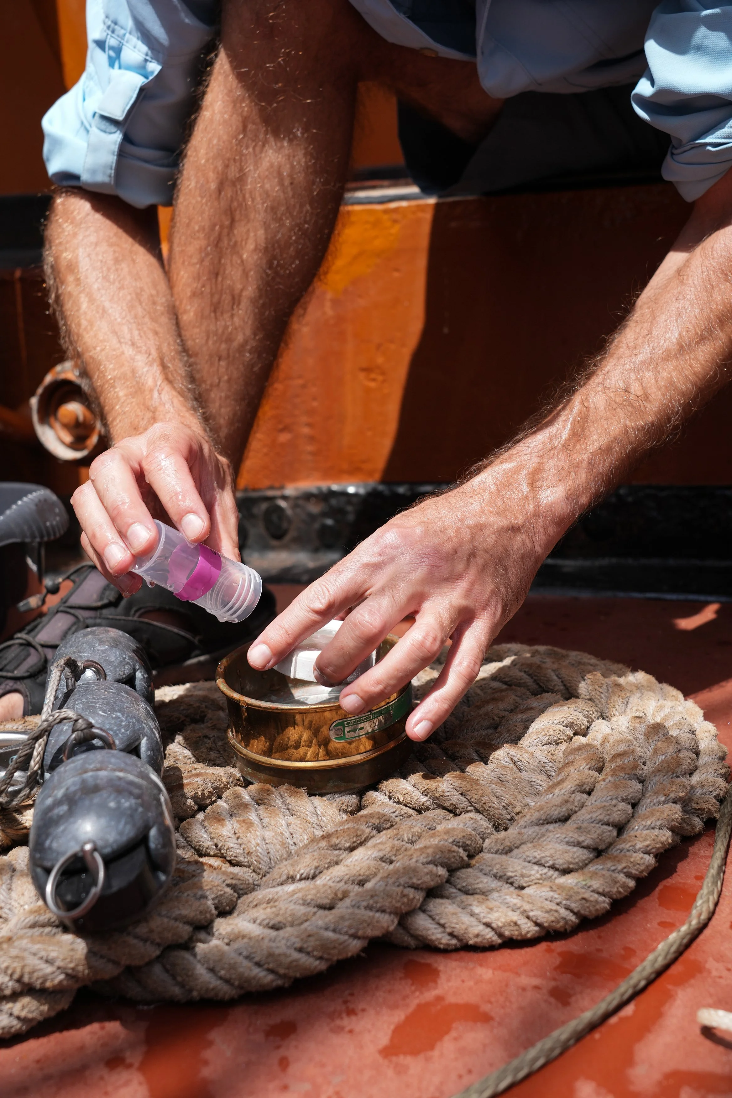 5 Cuen emptying sample into pot Close up.jpg