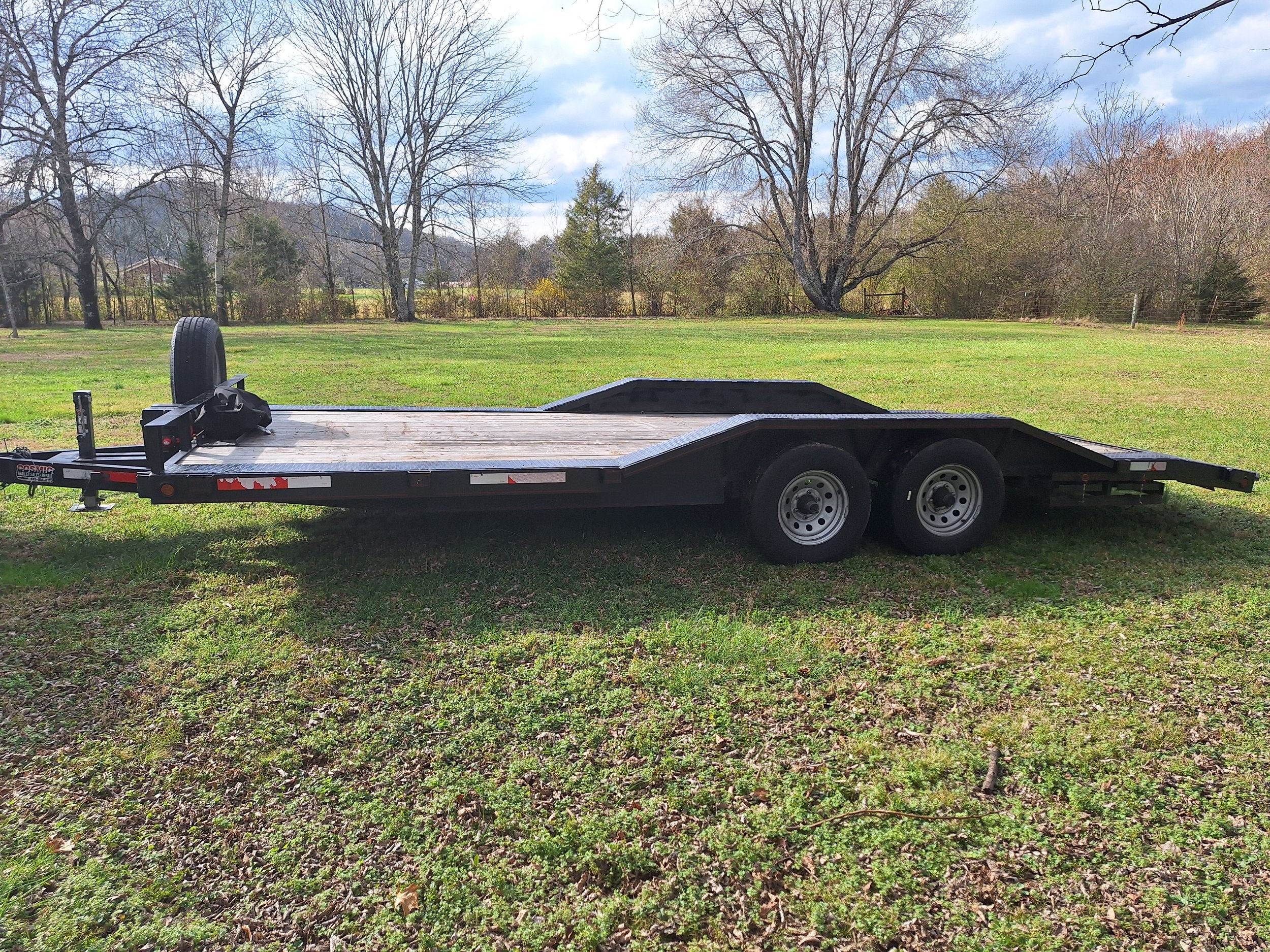 Flatbed trailer on grass field