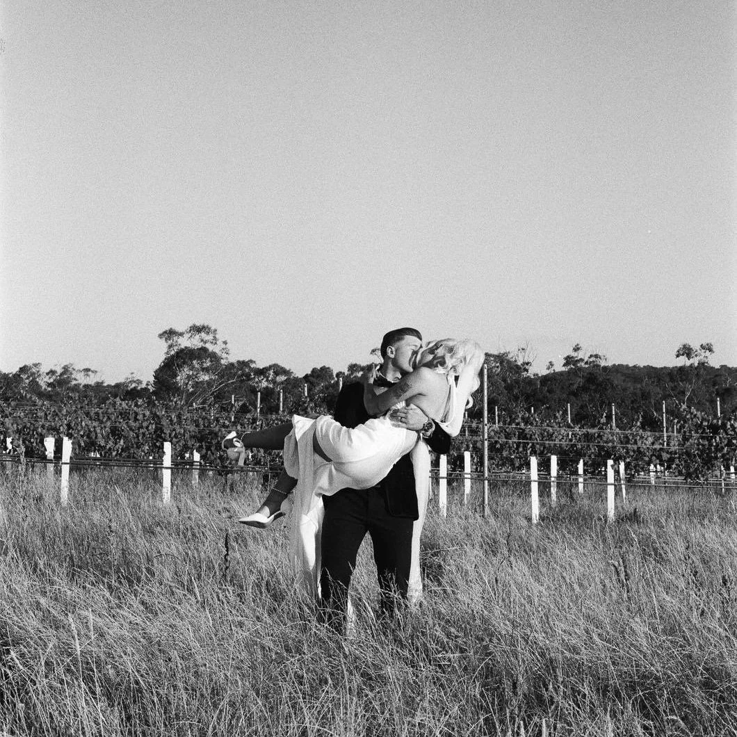 Coupel kissing in vineyards Yarra Valley.jpg