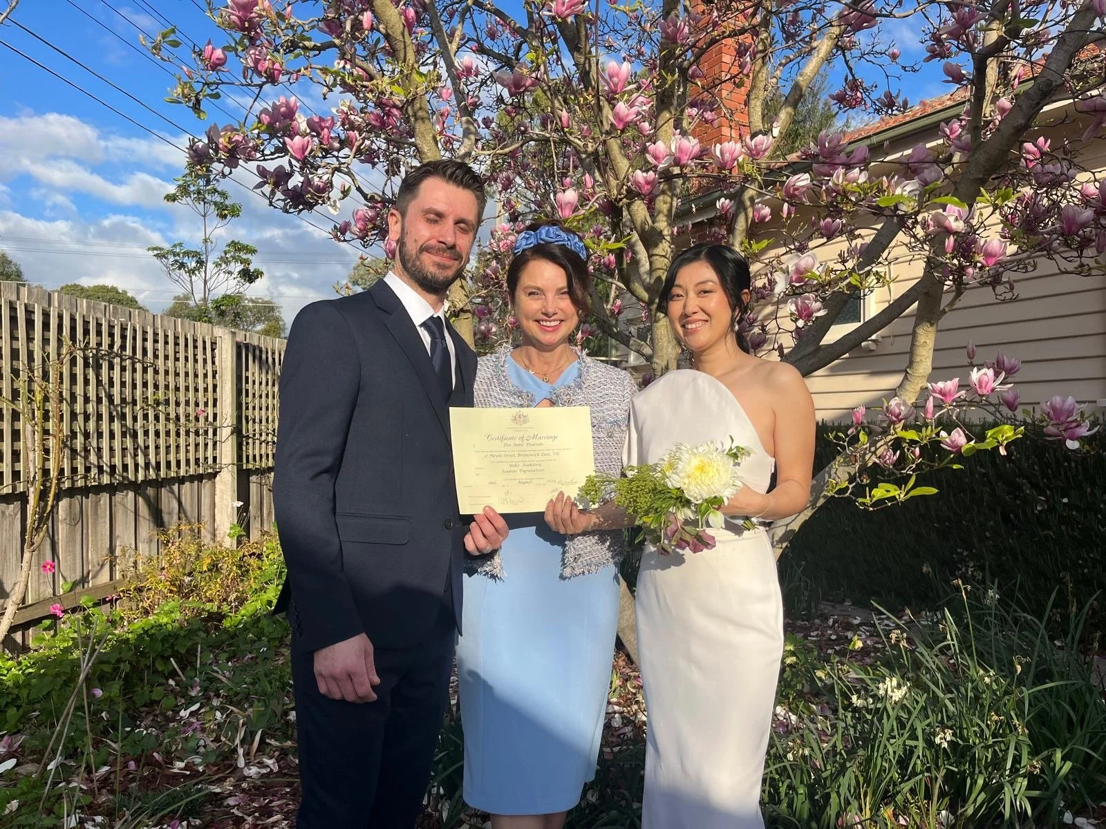 Dee celebrant with couple and marriage certificate.jpeg