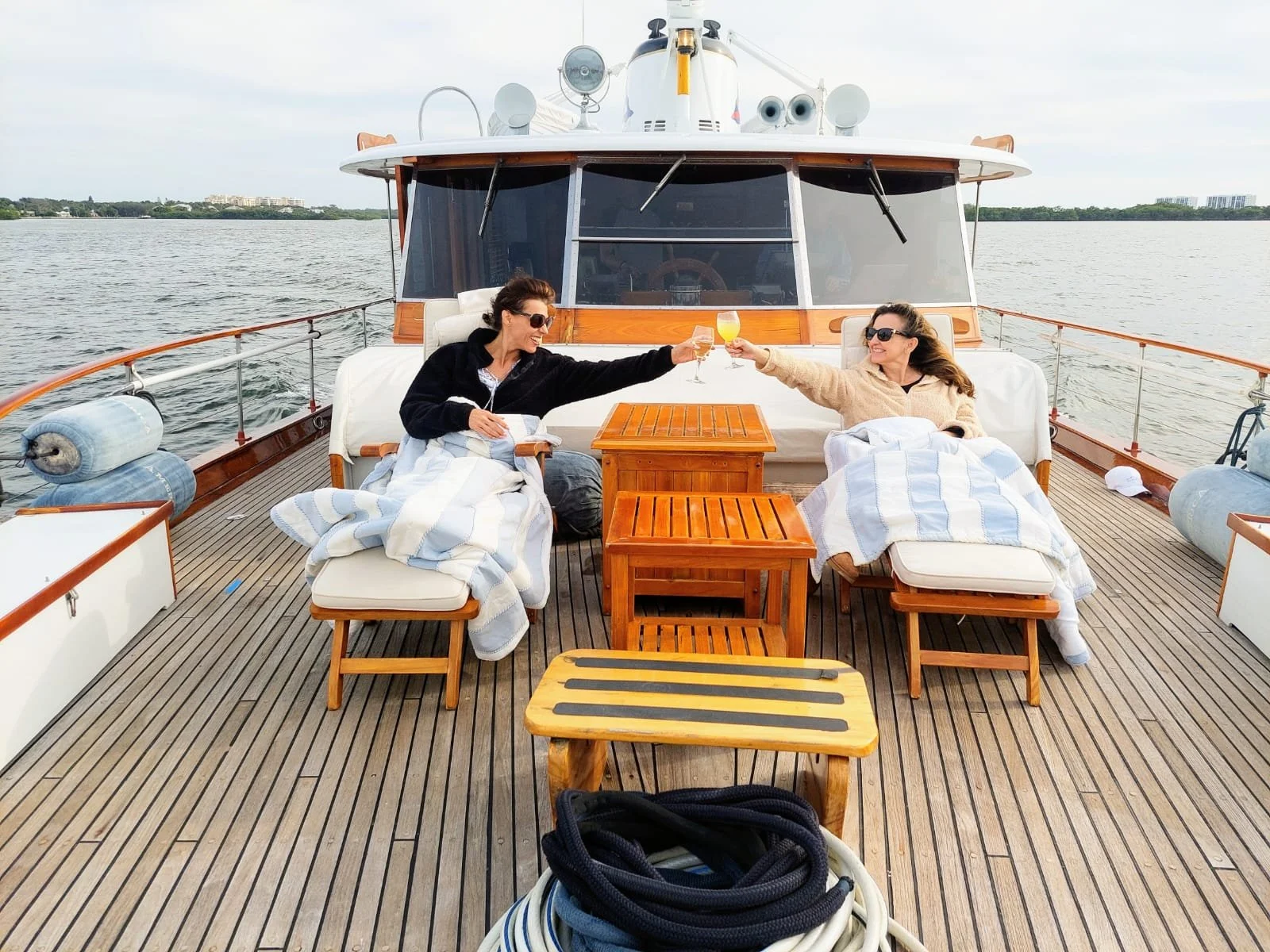 People enjoying drinks on the deck of AmericA