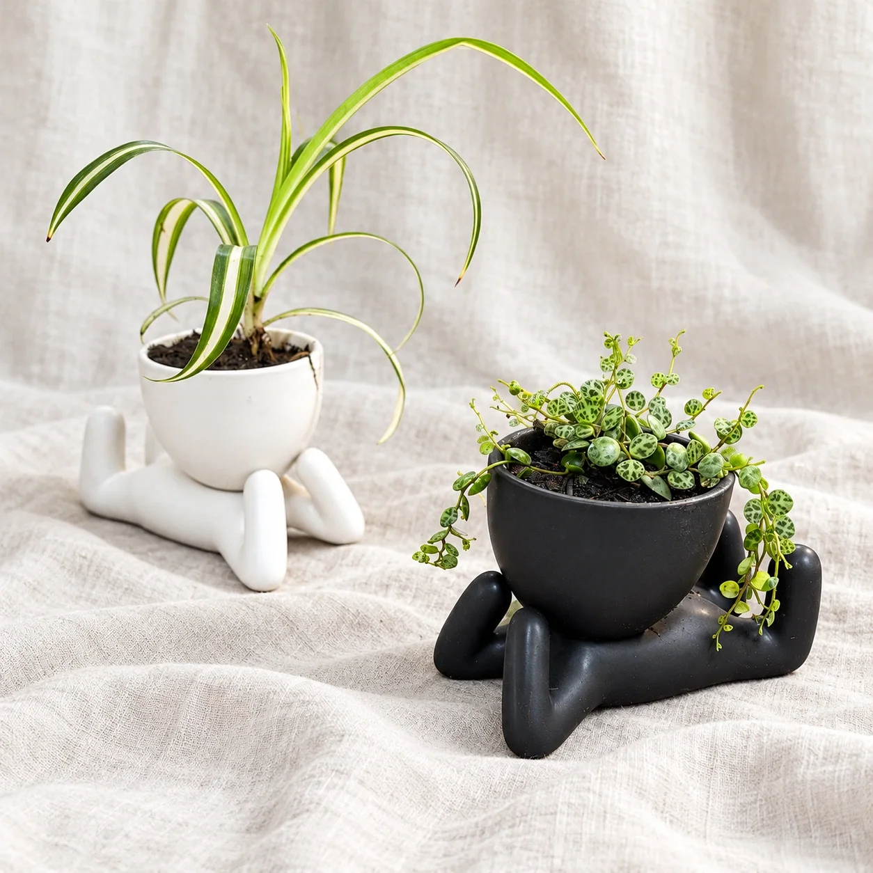 Reclining figure planters on white linen-1.webp