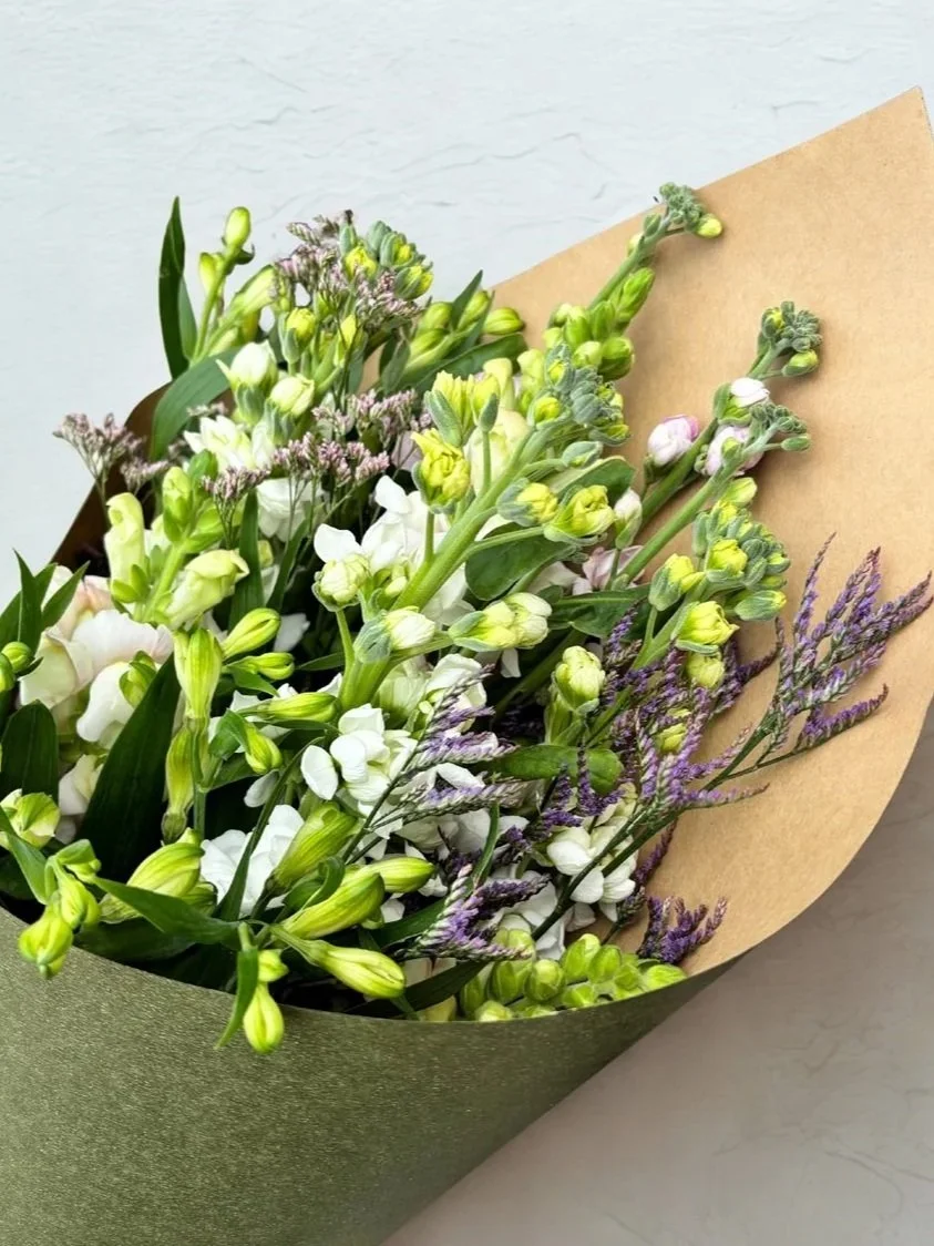 Charming cottage flower bouquet wrapped and ready for the vase, designed by Botanic Fusion florist in Havelock North.