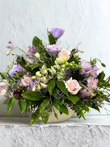 Colorful flower Arrangement with pink roses, purple, and white flowers in a white pot. Hospital Flowers, Delivery available Hastings, Havelock North & Napier.