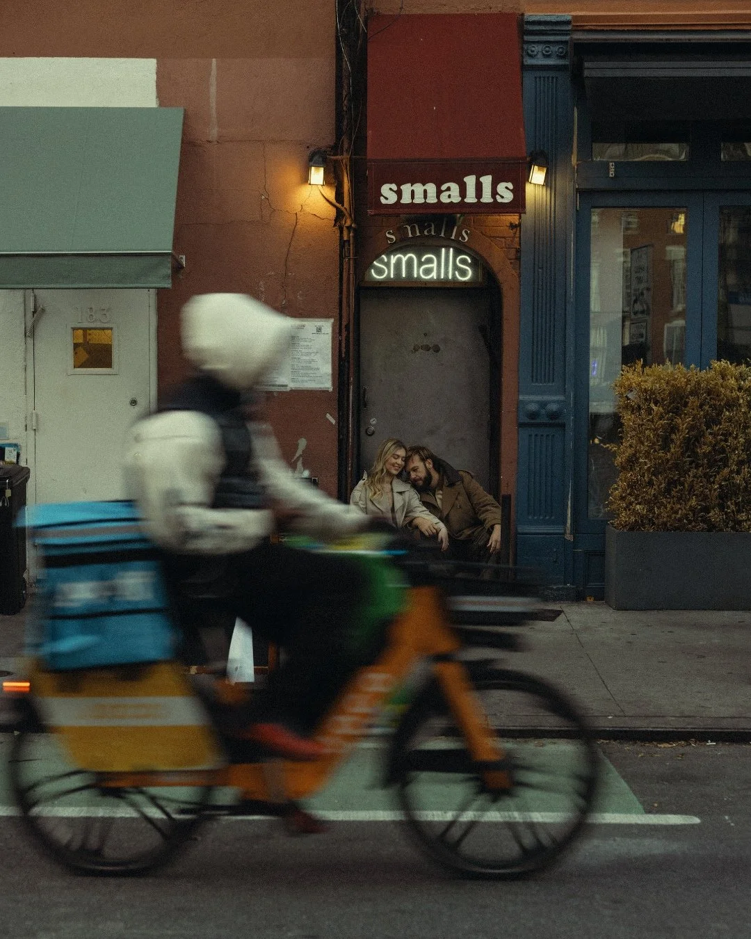 Couple laughing on West Village stoop