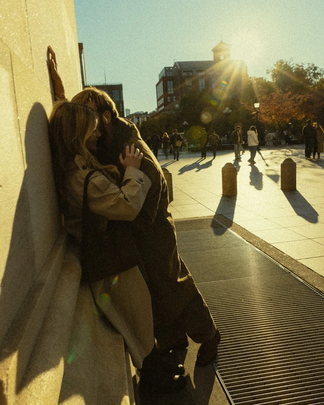 Blurry couple leaning against wall at Washington Square Park arch