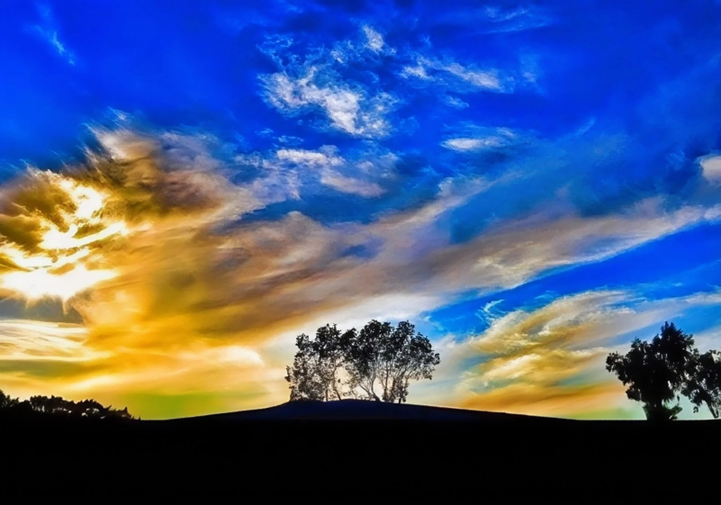 Golden Glow by Monique Rardin Richardson,

 Where Dublin Boulevard ends and the rolling East Bay hills begin. A perfect local vantage point to watch the sky put on a show.