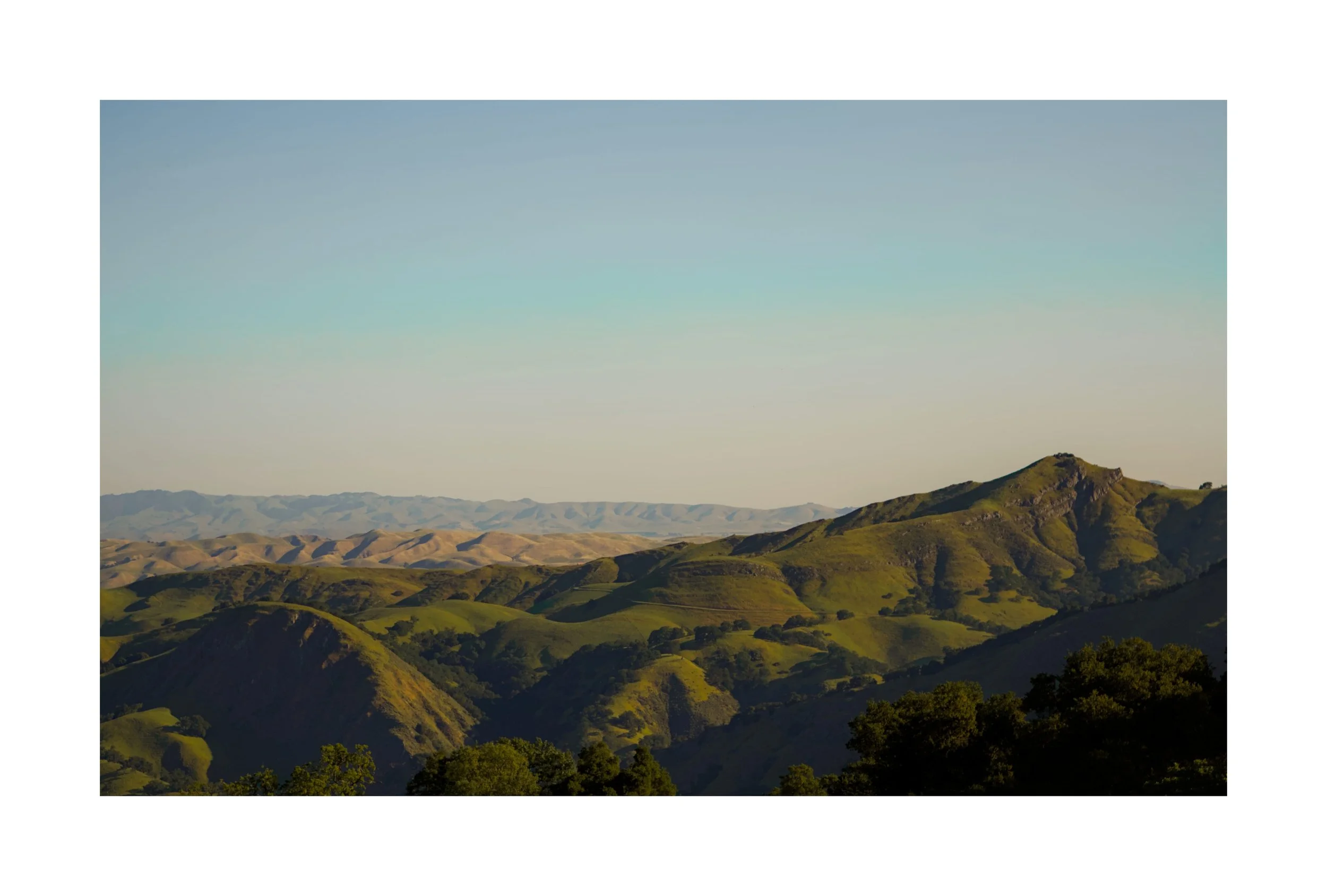 Green Fields by Young Chang. 

As the sun rose over the rolling hills at Sunol Regional Wilderness, golden light spread across the landscape and illuminated the vibrant green fields. The peaceful morning sky and soft sunlight created a breathtaking v