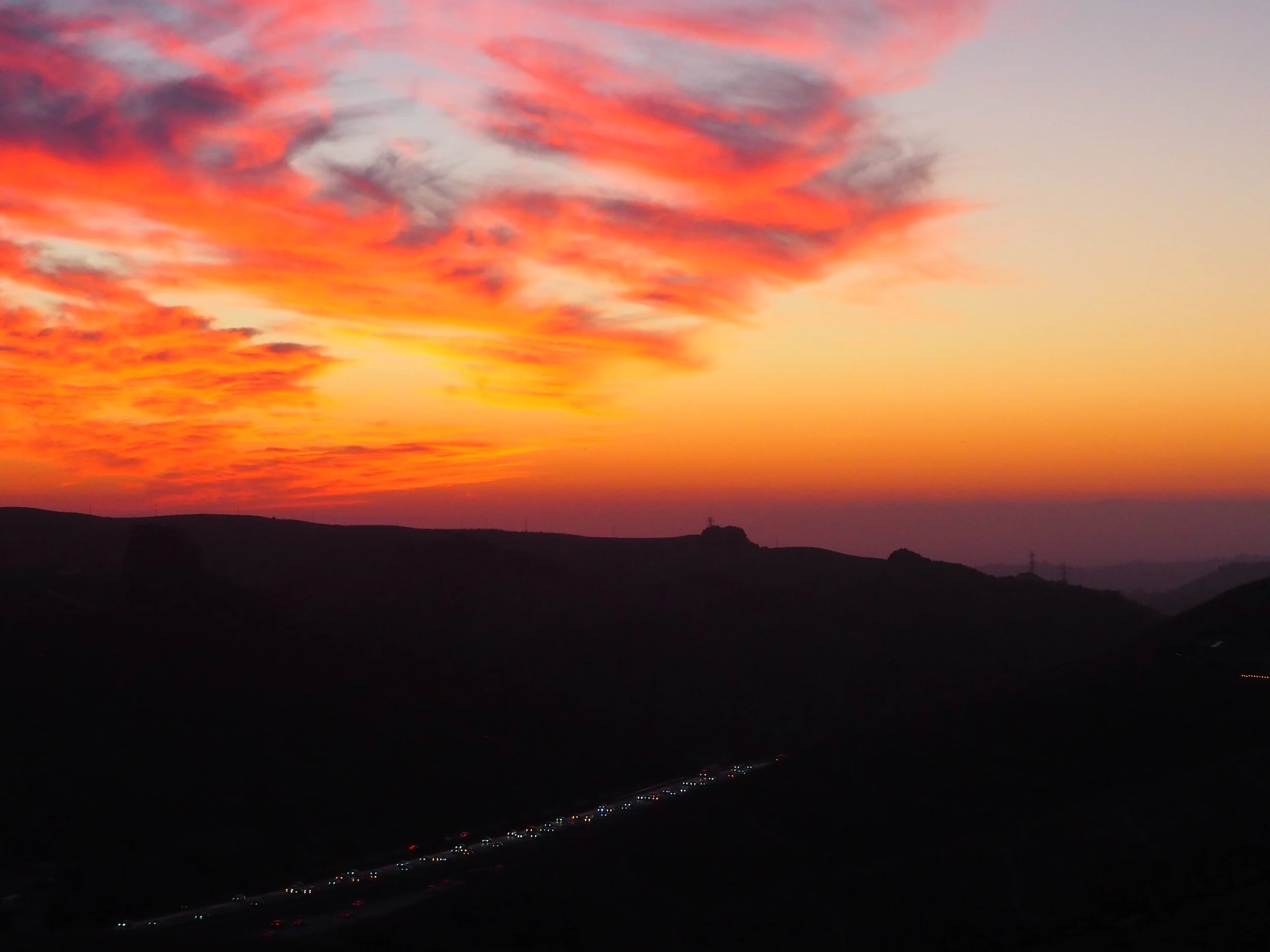 “Painted Sky” by Mackenzie Steele. 

 Looking from Dublin towards Castro Valley on Donlan Point. Taken in mid-October. It was my first hike up my hill with my newly gifted lens and the sky seemed to know that.
