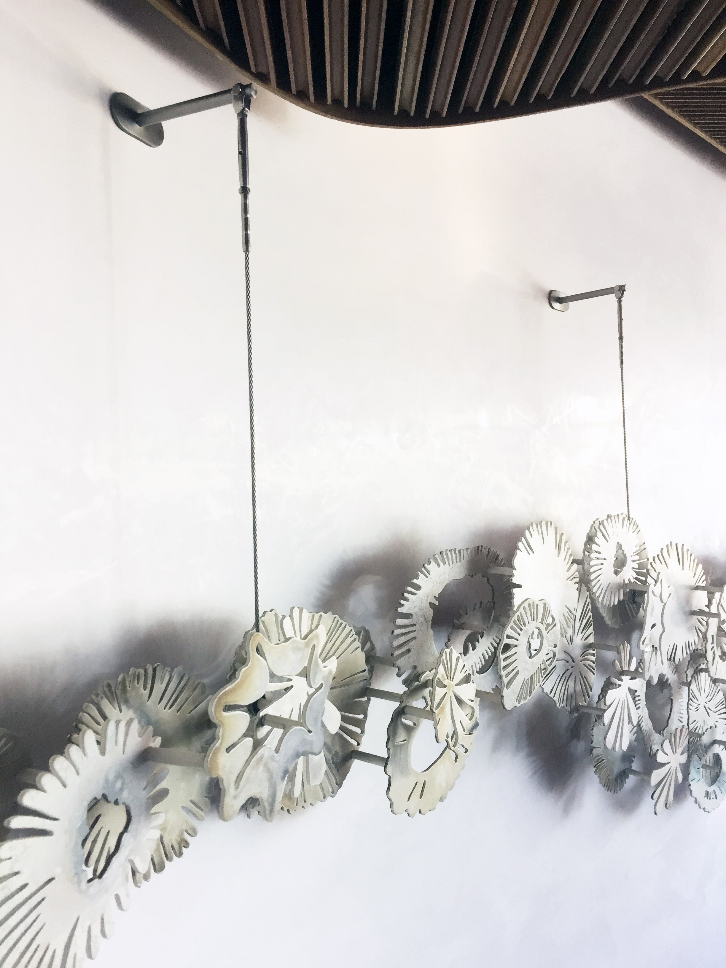 bespoke art installation of metal sculpture in an upscale Sydney restaurant installalled by Alessandro
