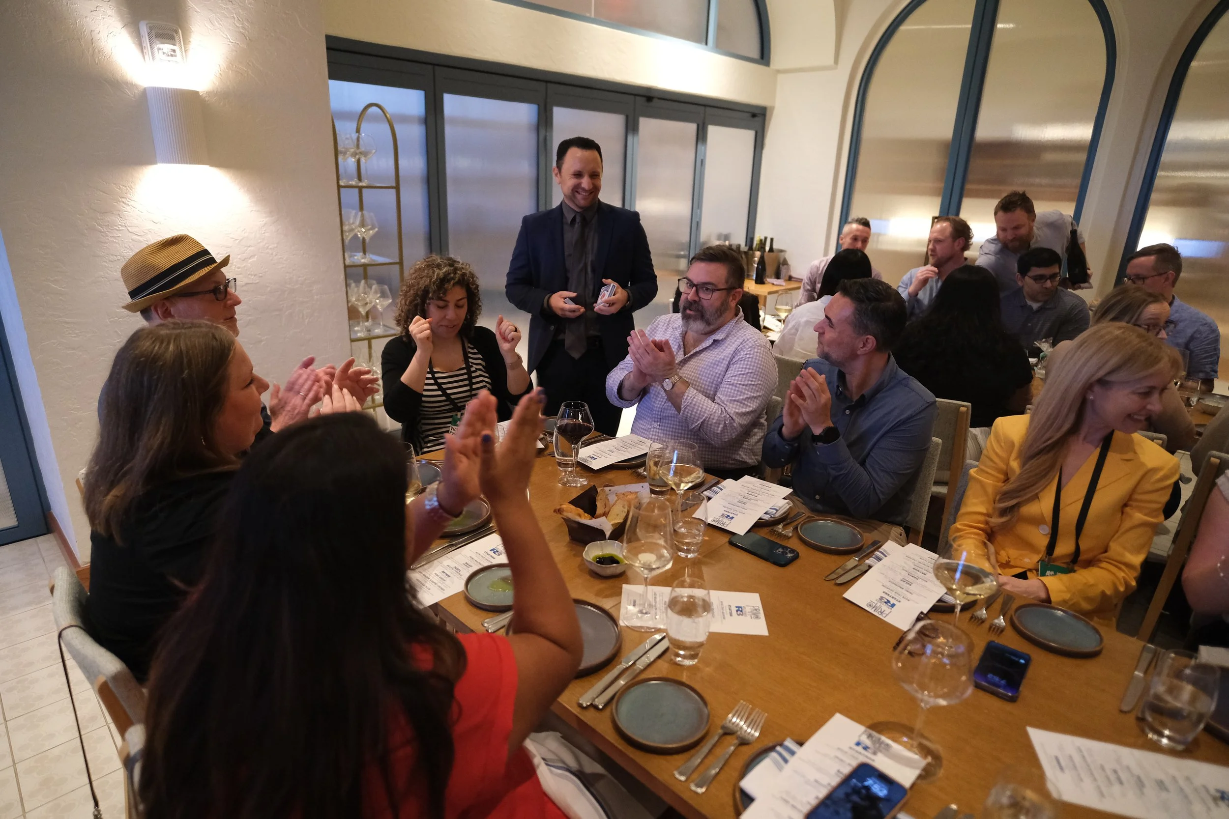 Close-up of corporate magician Ari Novick performing magic for a professional audience in Connecticut.