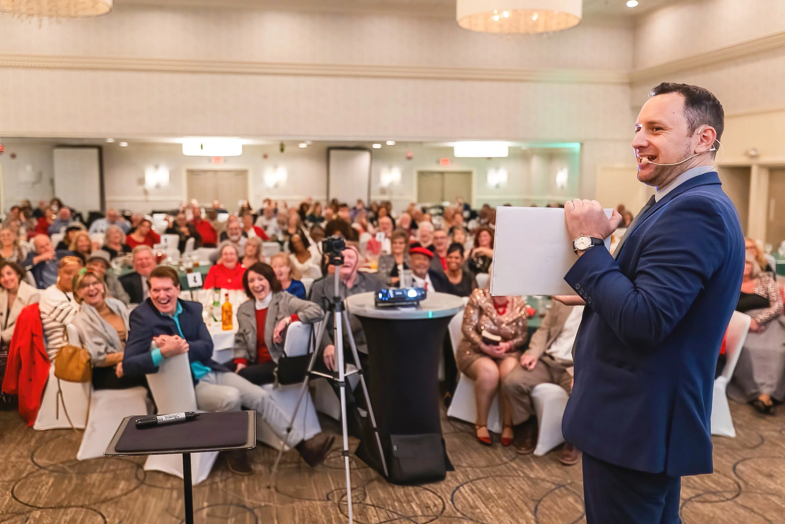 Professional corporate magician Ari Novick providing interactive corporate event entertainment at a business event in Connecticut.