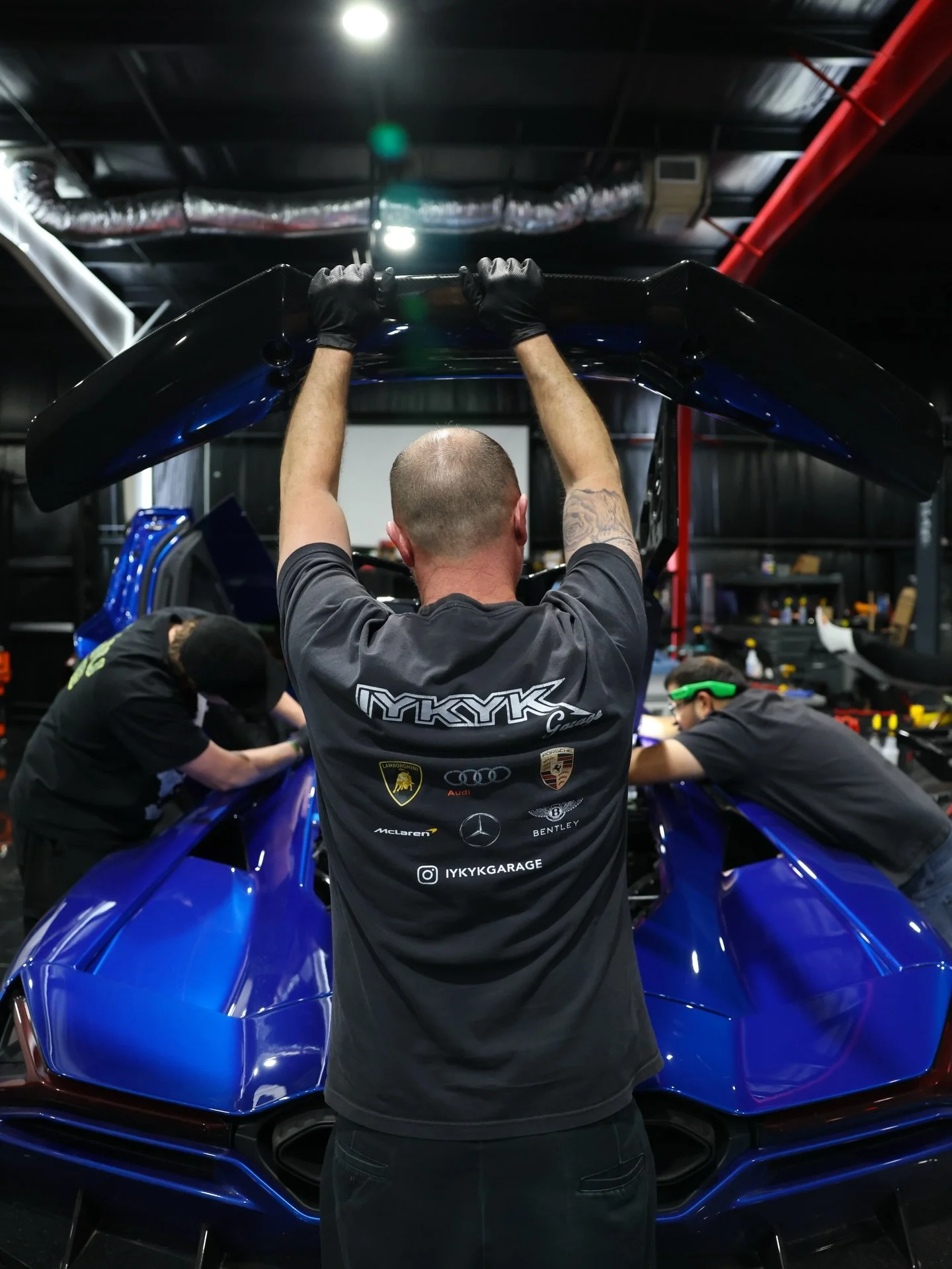 Custom carbon spoiler and engine cover installed on this Revuelto! 💥Thinking about getting some carbon done to your ride? Shoot us a DM! 

#iykykgarage #carbonfibre #carbonfiber #lambolovers #revuelto