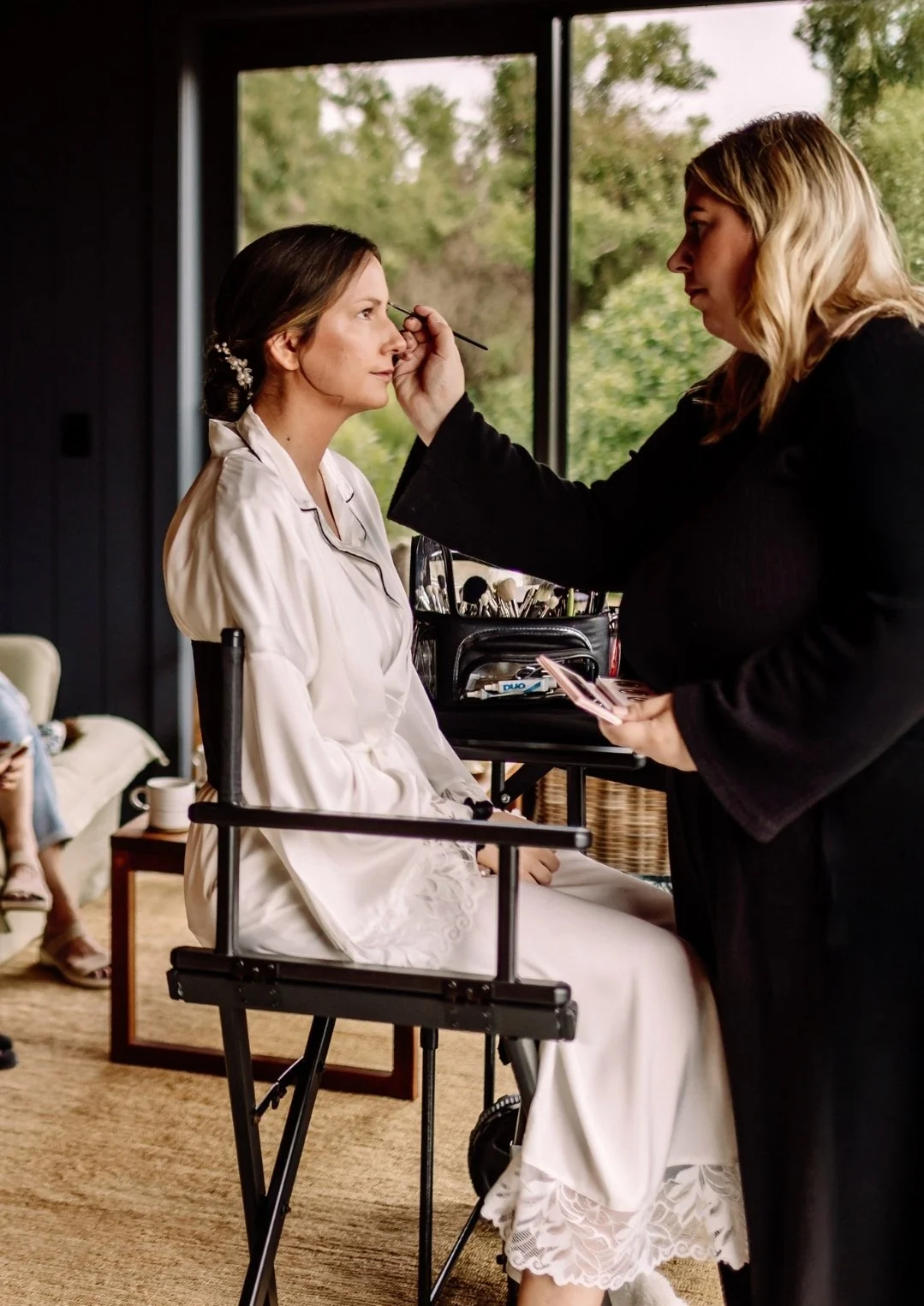 Bridal makeup artist applying makeup to bride in Christchurch