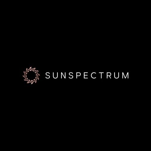 The Sunspectrum logo with a laurel wreath design and the word 'SUNSPECTRUM' on a black background.