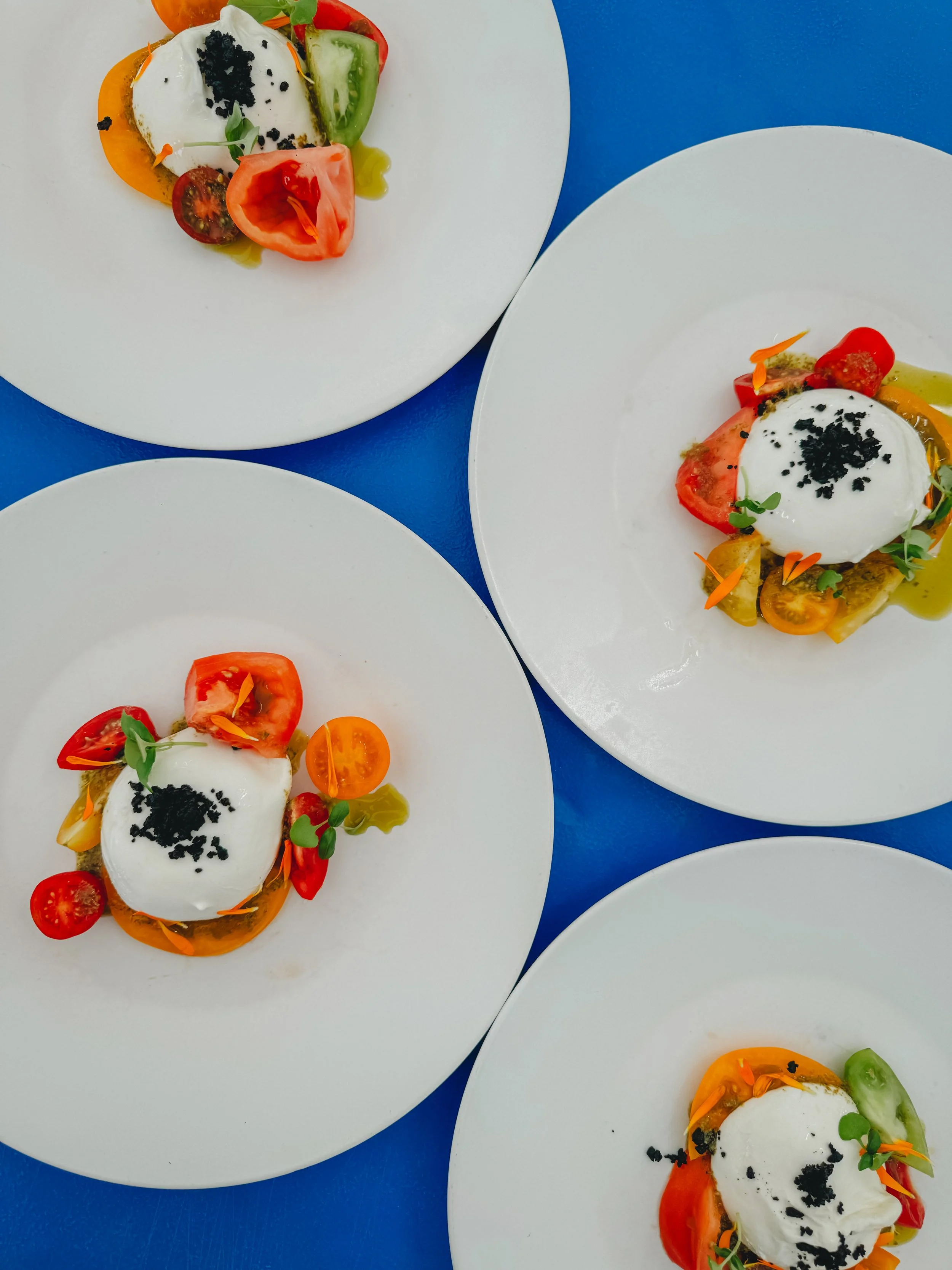 Burghley Horse Trials 2024 - Nutbourne Tomato, Burrata, Black Olive, Basil and Black Garlic. 