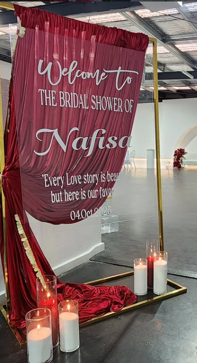 maroon welcome sign .png