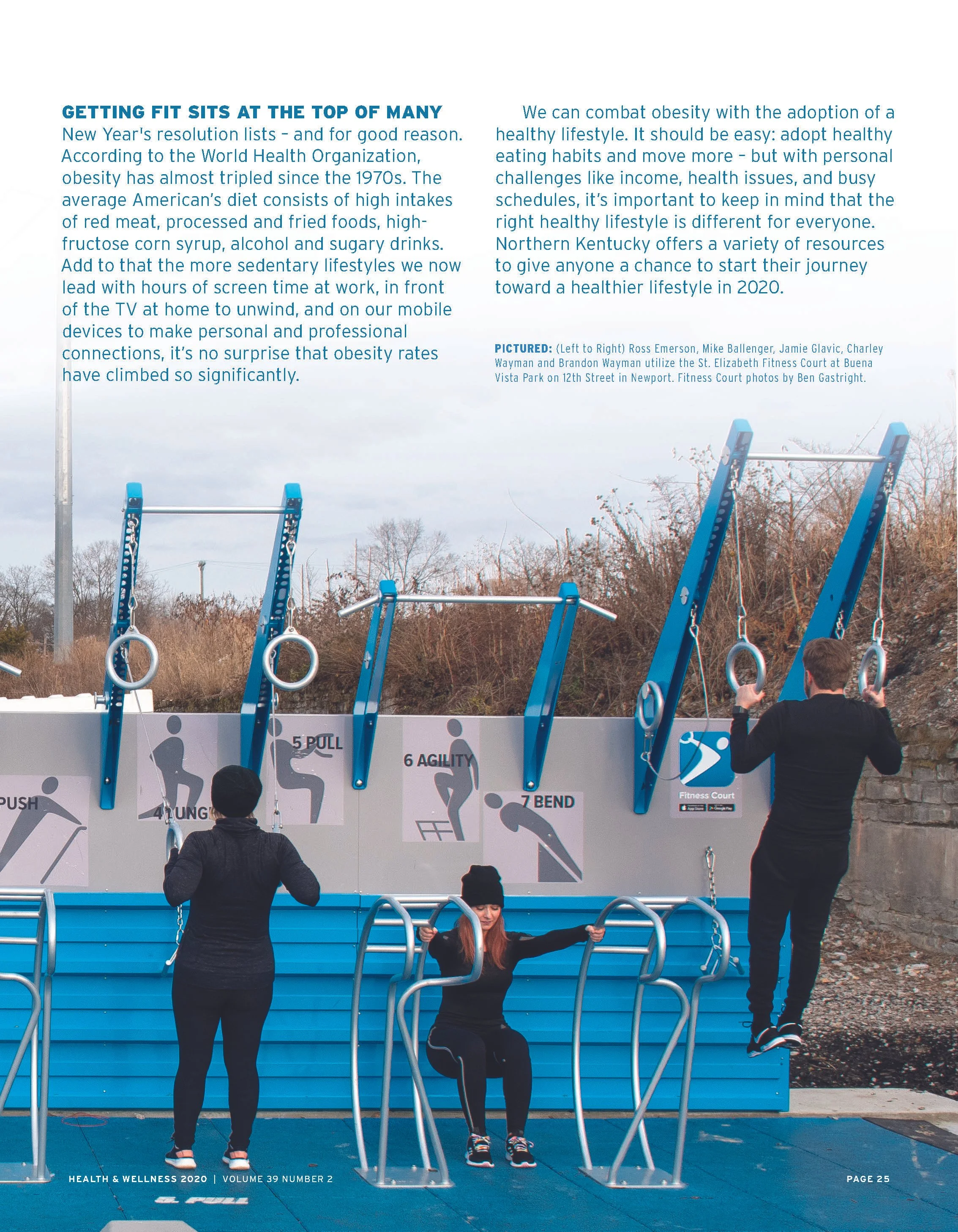 Three people using outdoor fitness equipment in a park, with instructions for exercises on a wall behind them.