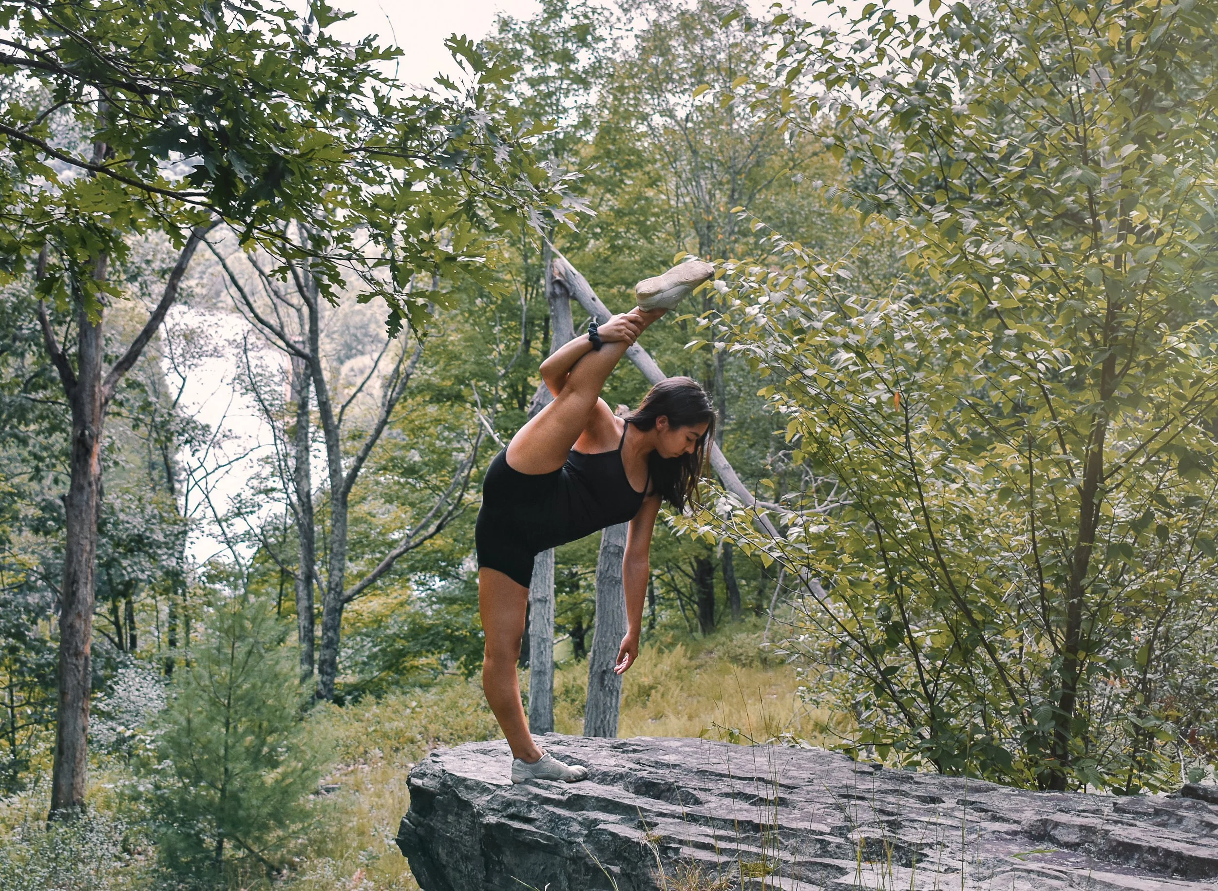 Noa standing split rock.jpg