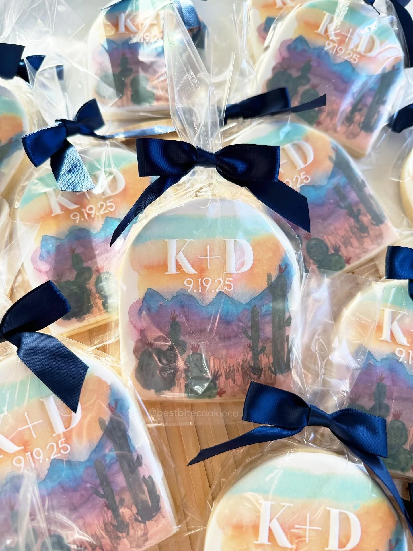 Wedding cookie favors 🫶🏼 

Perfect addition to wedding party favors, dessert tables, table placements, etc.! 

I wish I took a picture of these before packaging them because that desert painting is so pretty. Achieved this look with @eddie_ediblein