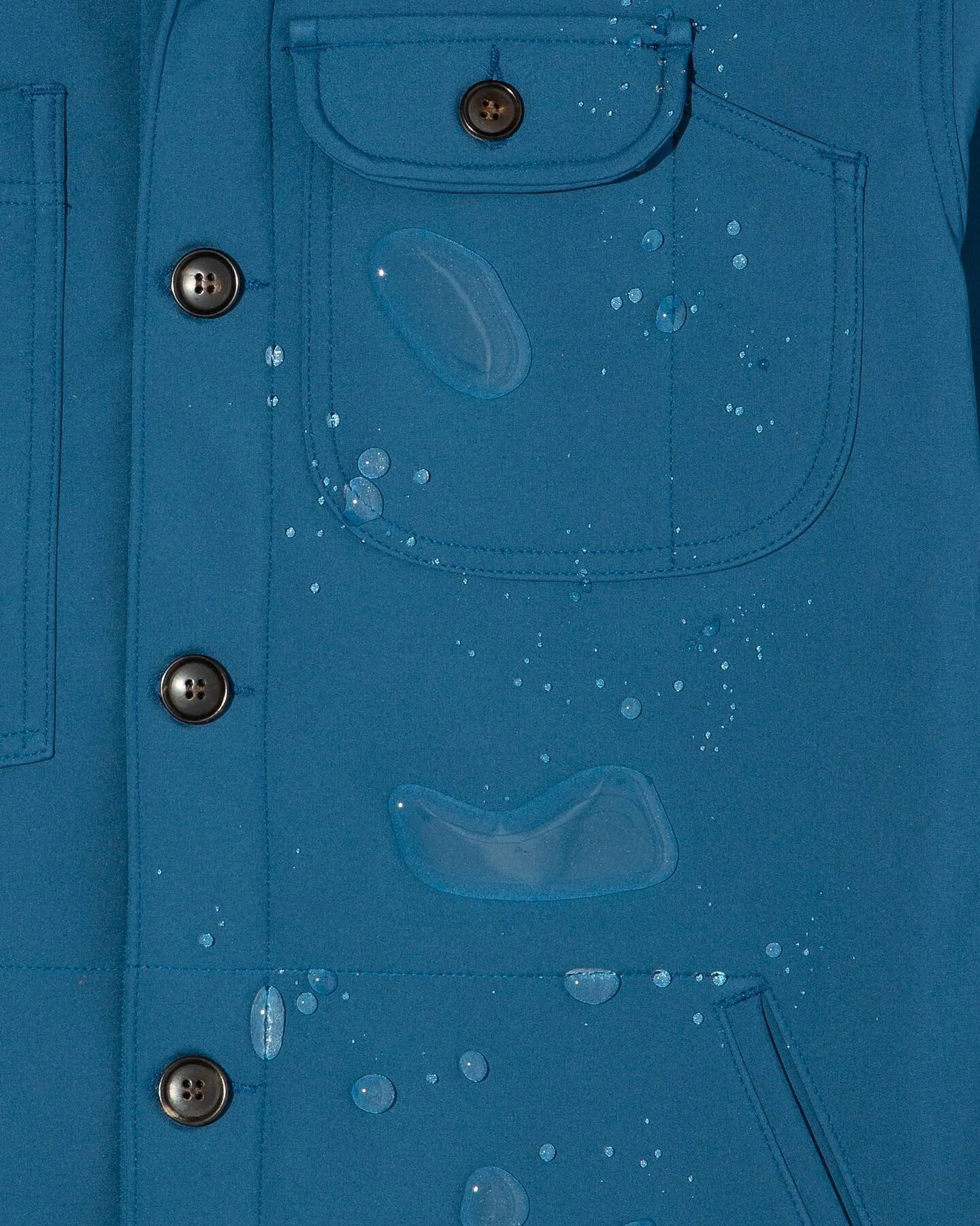 Couple of these still kicking around our Archive (always a little sale there):

Camp Shirt designed to handle just about anything: waterproof outer with a bonded, recycled poly fleece lining. 

x oz Nyco canvas trench with a durable water repellent f