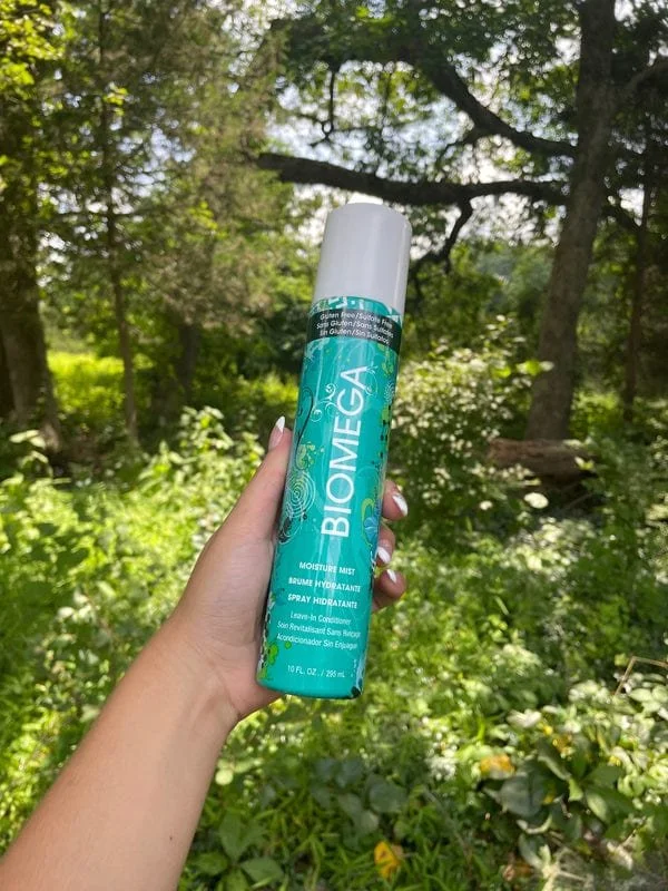 Aquage-Biomega-Moisture-Mist-Conditioner-10oz-against-tree-background.jpg