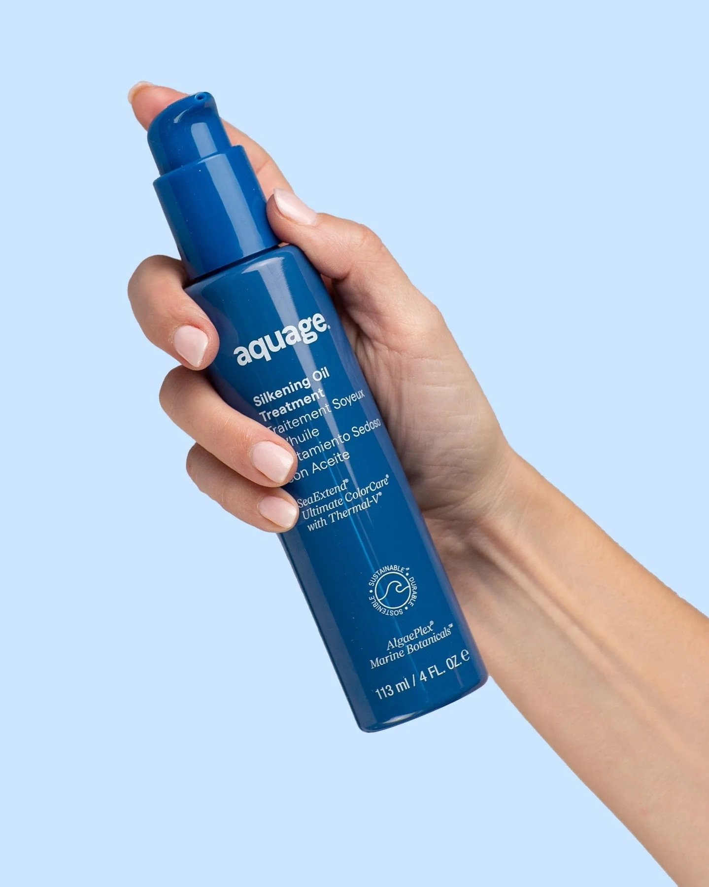 Aquage-SeaExtend-Silkening-Oil-Treatment-4.5oz-with-model-hand.jpeg