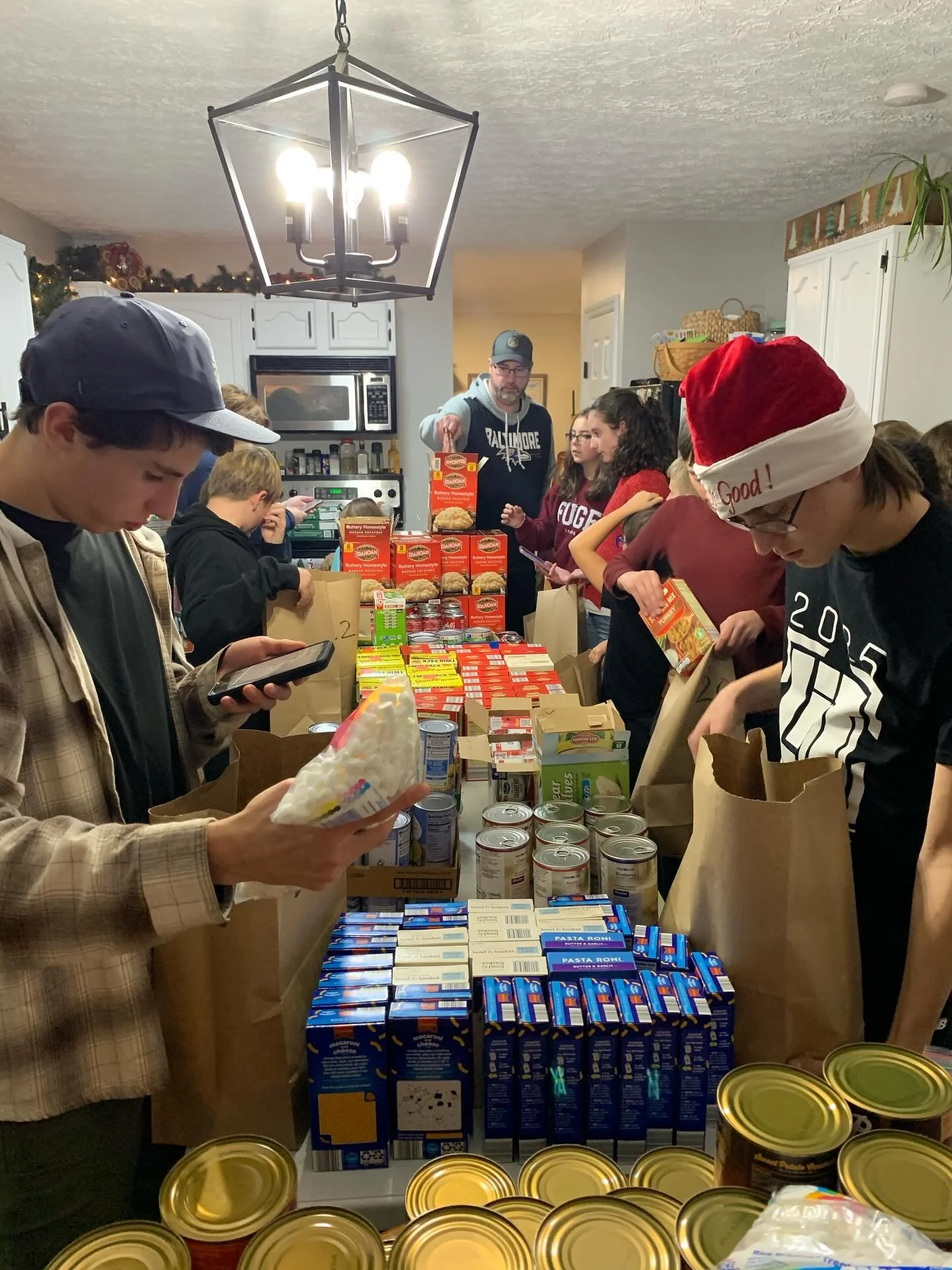 Dwell City Students spent the evening preparing Thanksgiving bags for our community food giveaway tomorrow morning. They also made and decorated cards with special notes of encouragement to bless each person and had a time of prayer over the event. ?
