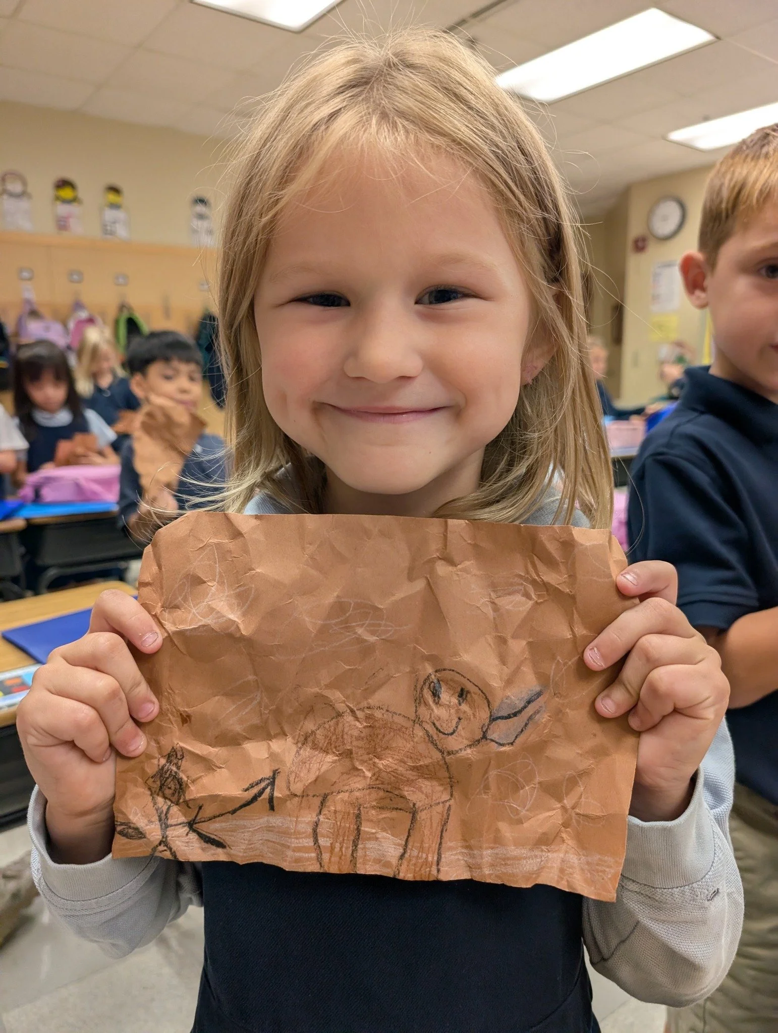 1st Grade fun! Yesterday, 1st grade learned all about cave paintings! Students had a chance to be nomads, adding paintings to "cave walls."