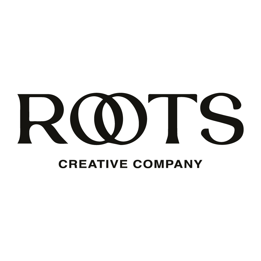 A black and white logo for ROOTS Creative Company.