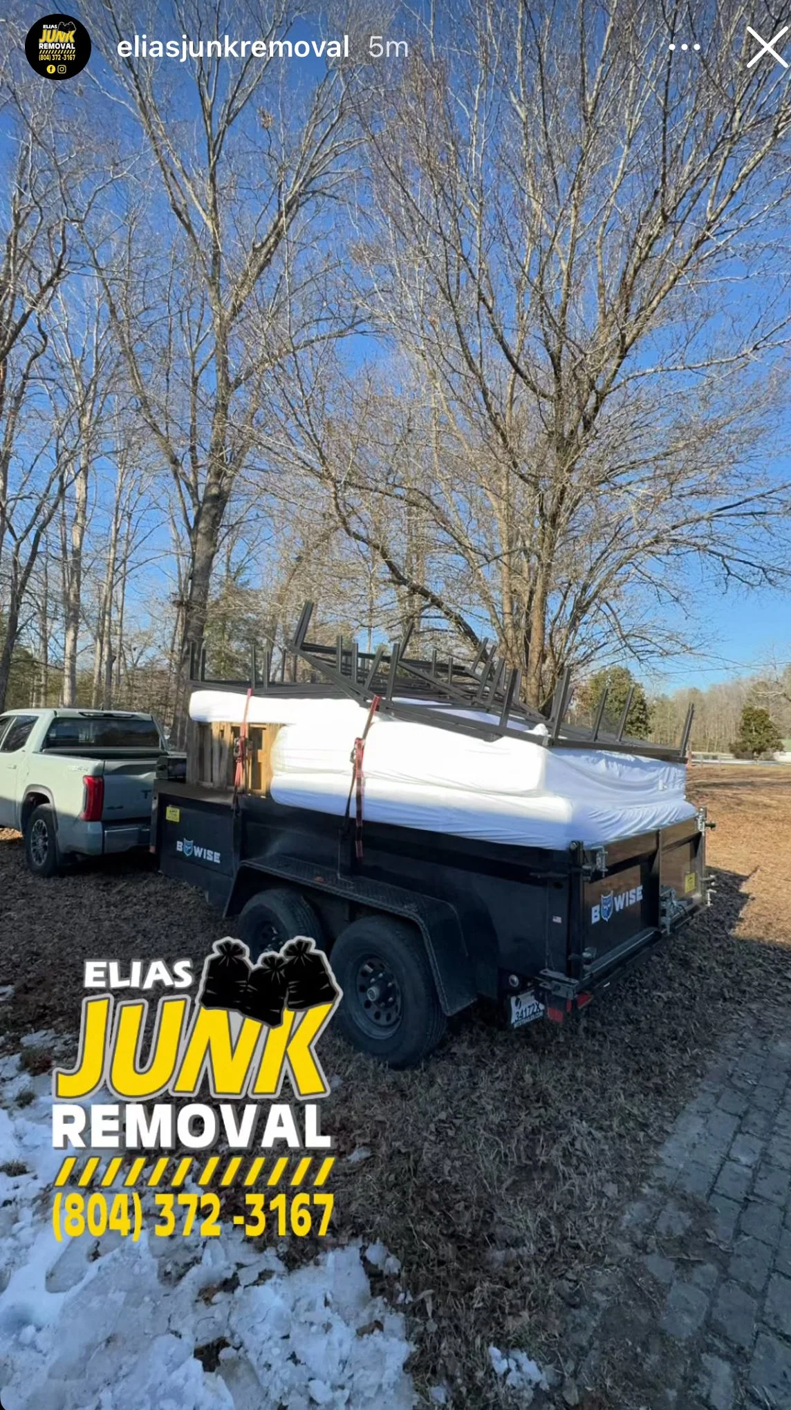 Elias Junk Removal removing old mattresses on a snowy day