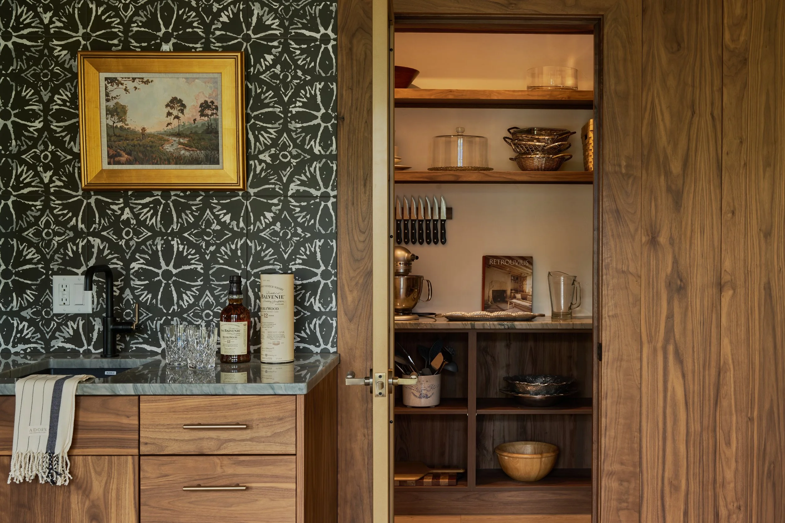 Graphic tile, walnut cabinets, brass hardware, pantry, dry bar