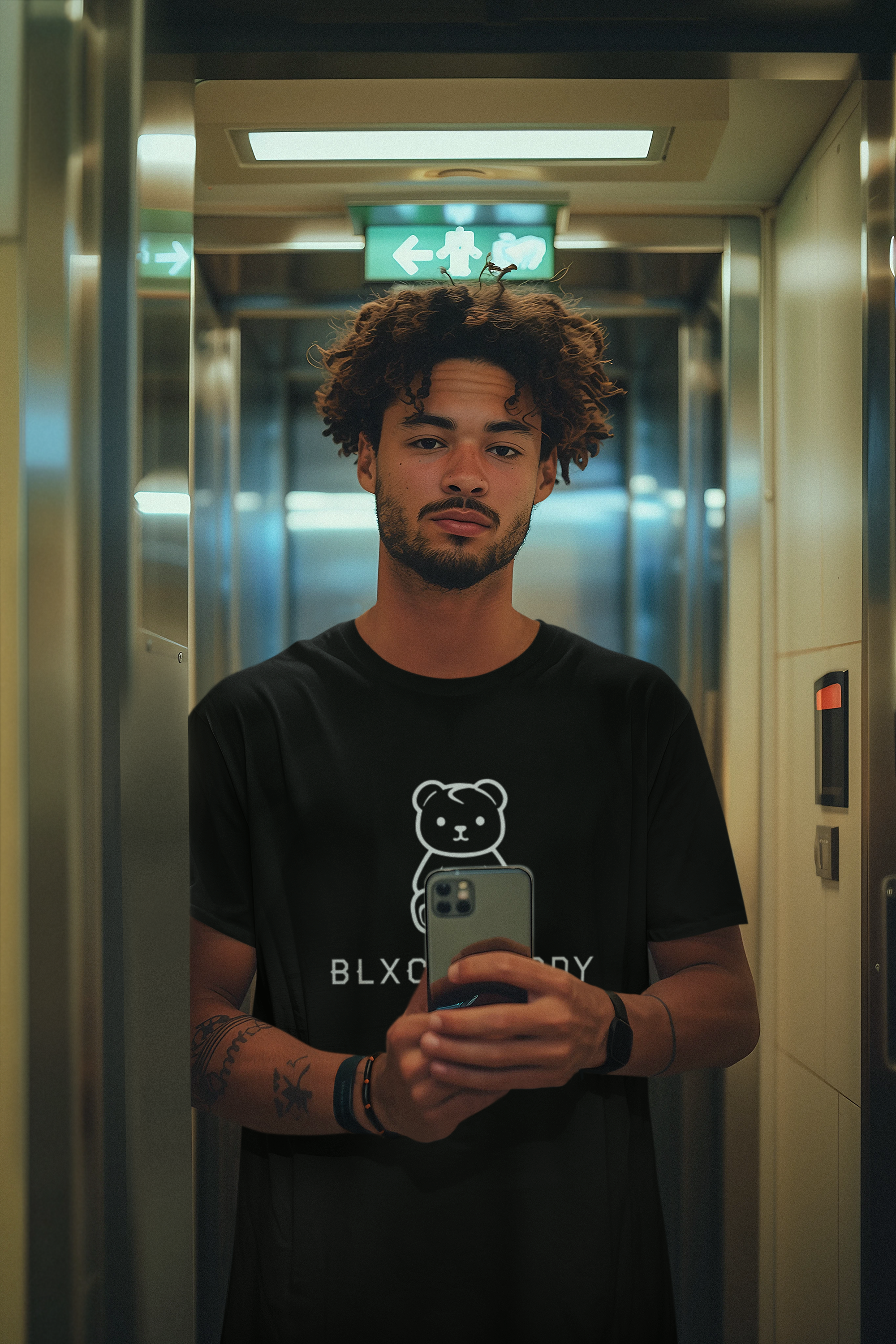 t-shirt-mockup-of-an-ai-created-man-with-tattoos-taking-a-selfie-in-an-elevator-m38863.png