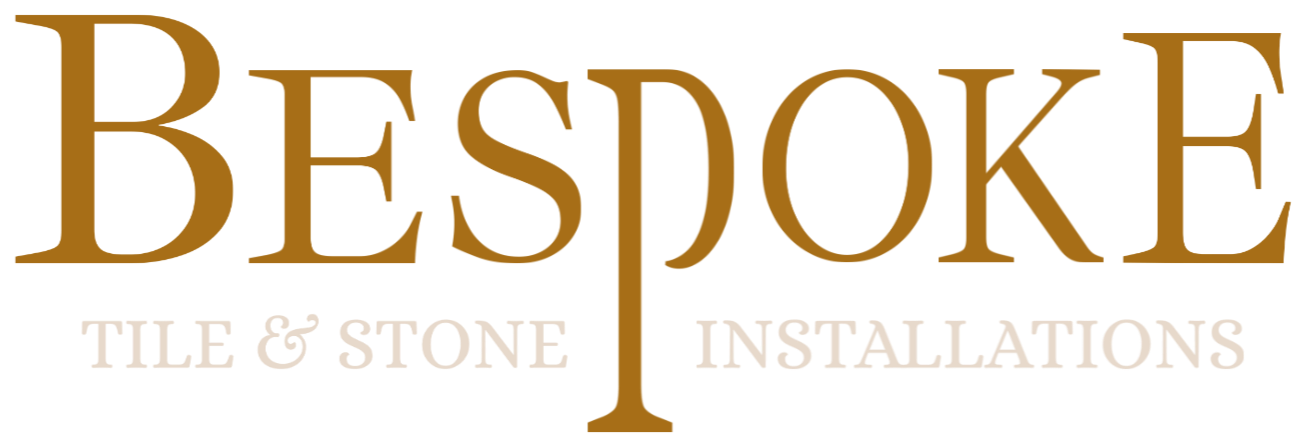 Logo for Bespoke Tile & Stone Installations with the company name in large gold and linen lettering.