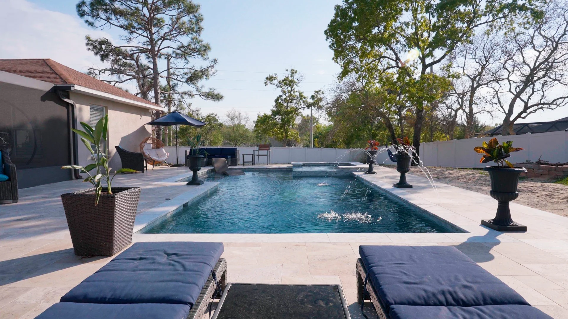 New swimming pool design with water jets, spa, lounger and swim shelf