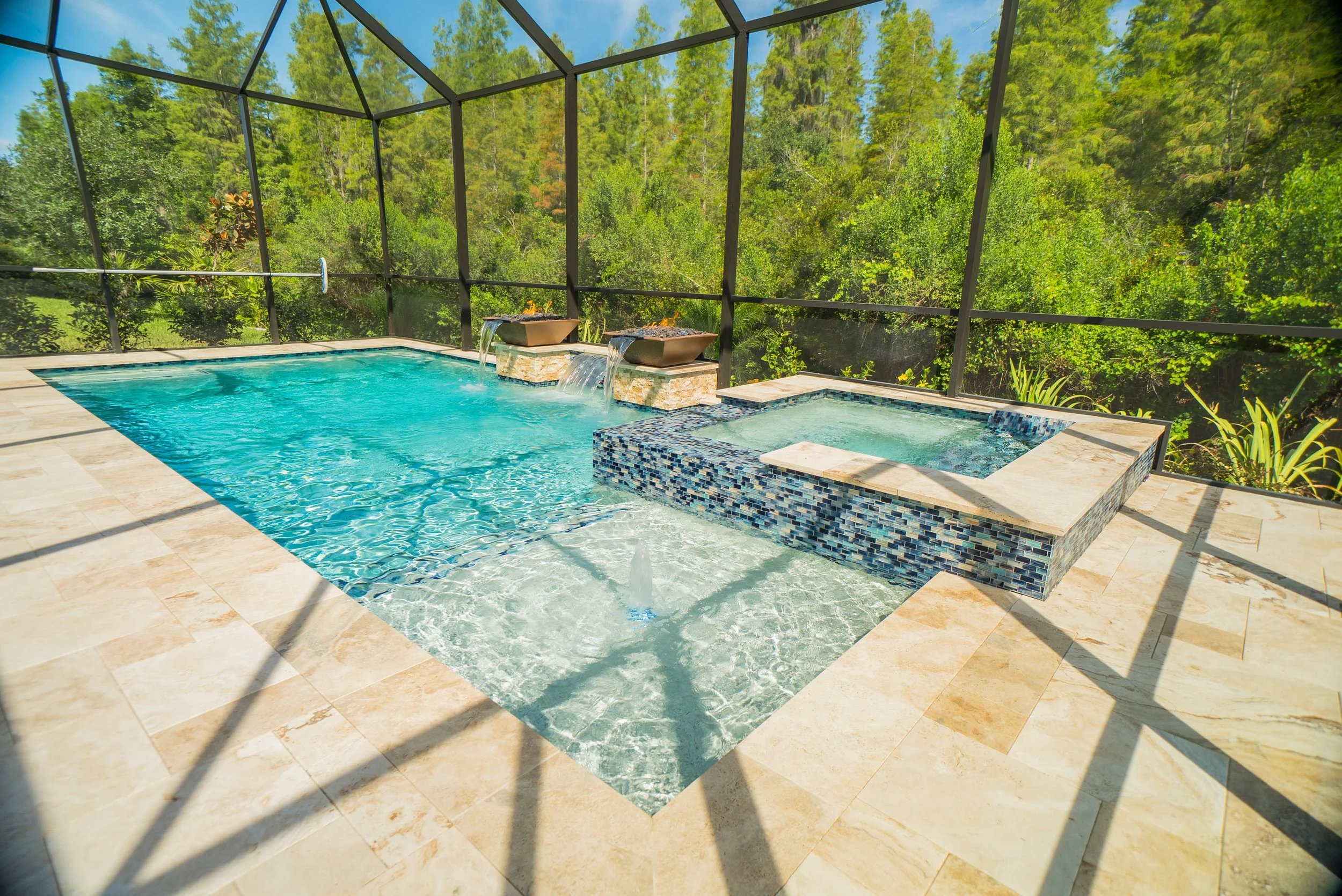 Swimming pool with fire bowls, waterfalls and spa