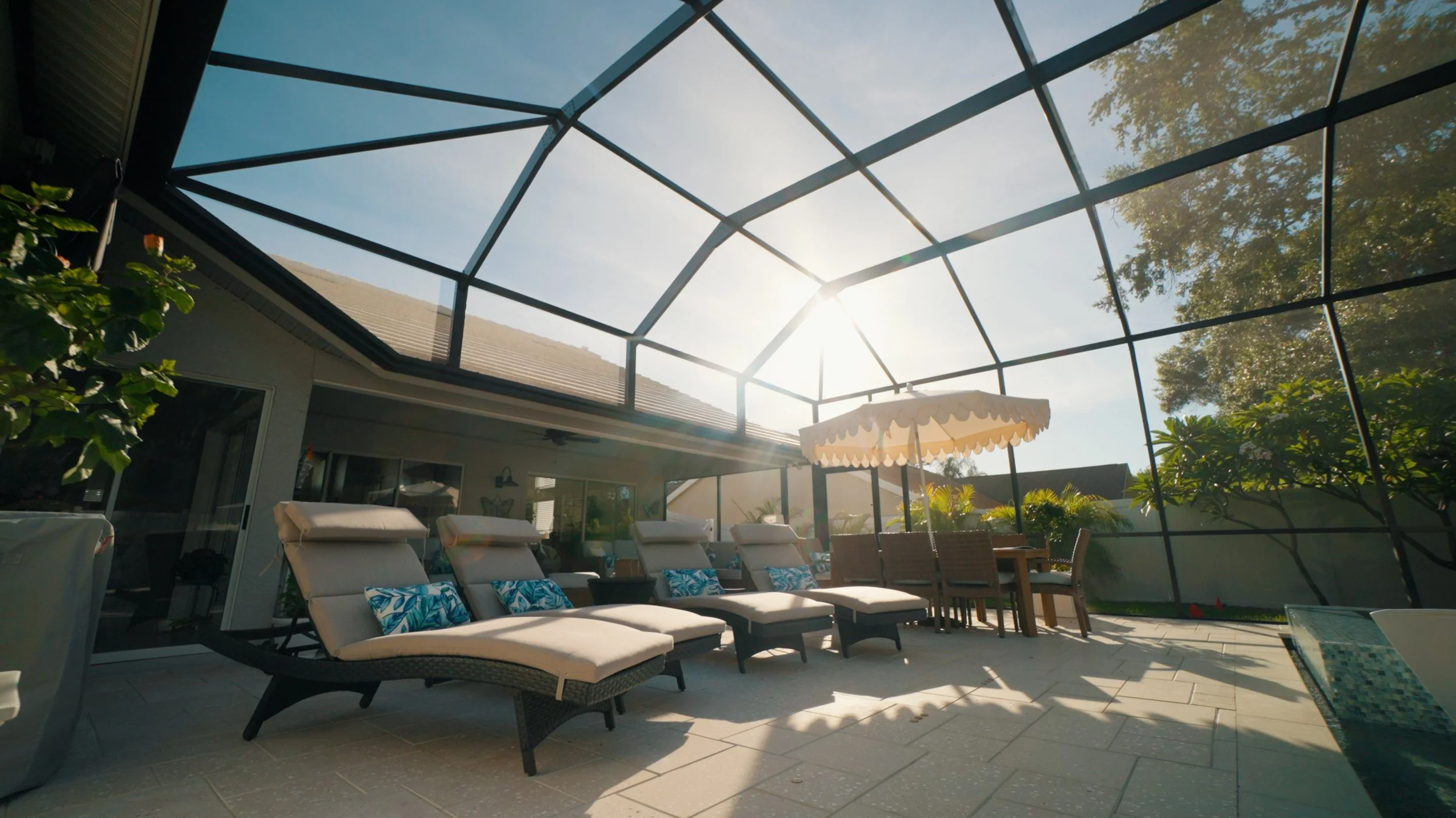 Swimming pool construction with patio and outdoor living space