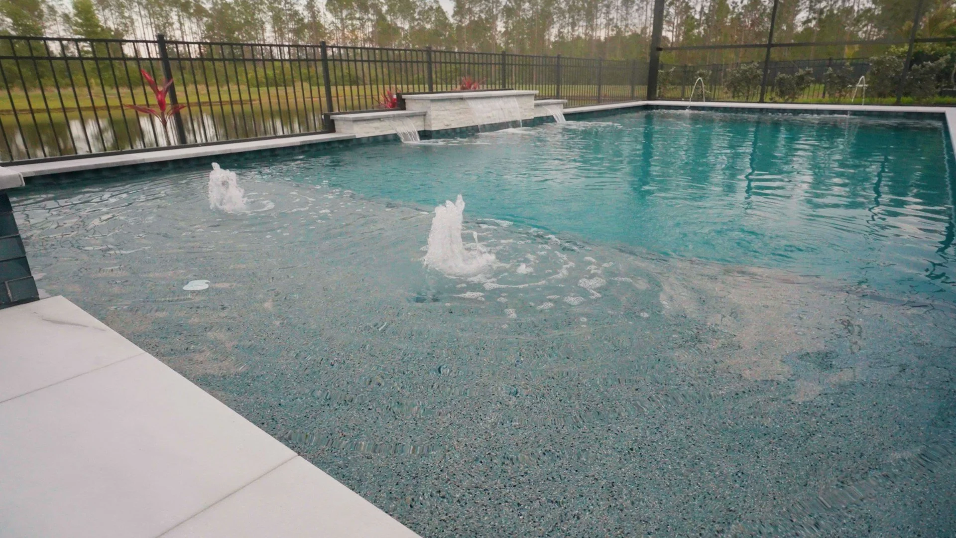 custom-swimming-pool-sun-shelf-bubblers.jpg