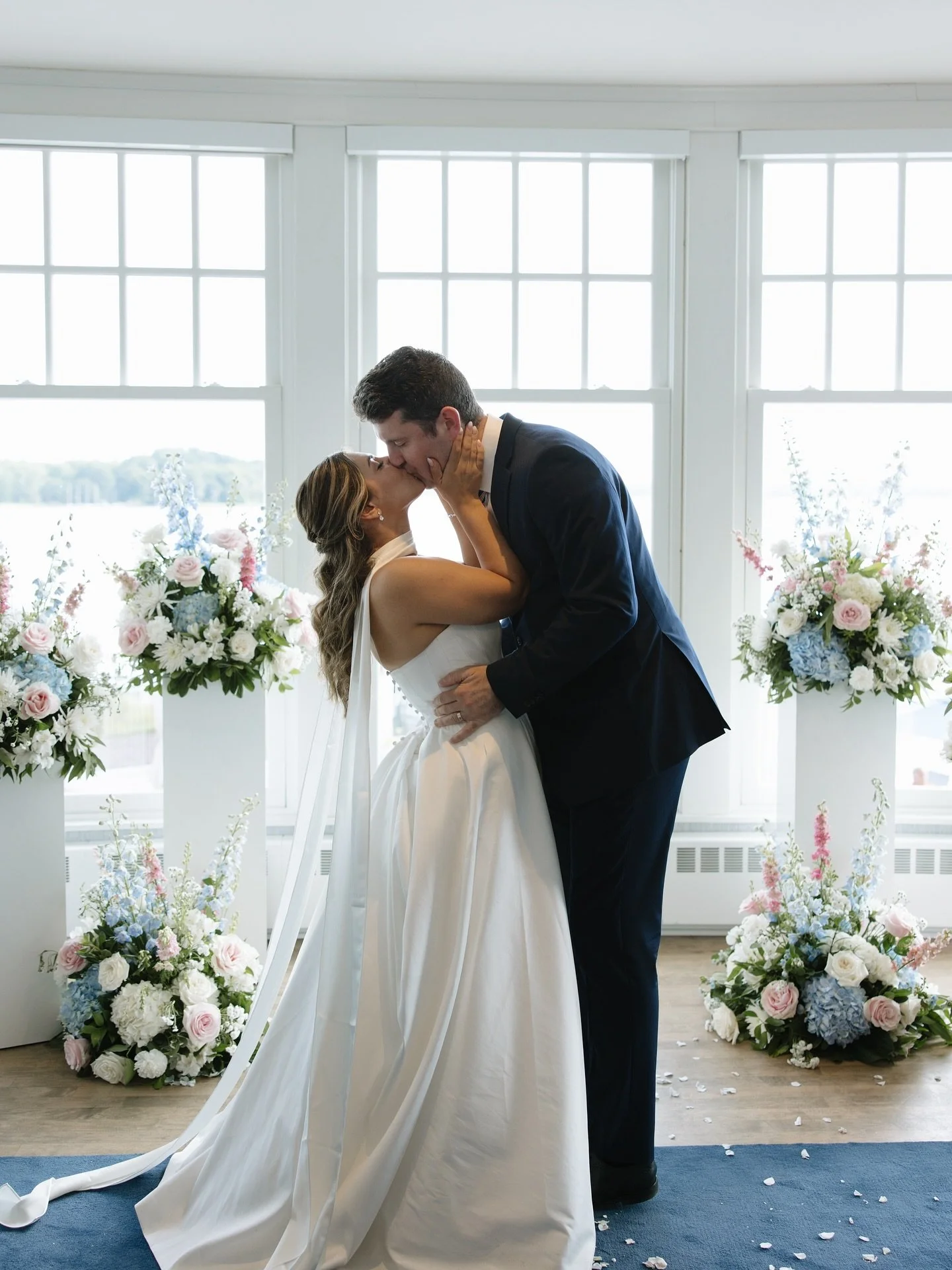 Why leave your ceremony florals behind when they can join your for the fun at the reception? The ceremony is the shortest part of the wedding, but your flowers can add impact and beauty to your event all night. These ceremony sprays were repurposed a