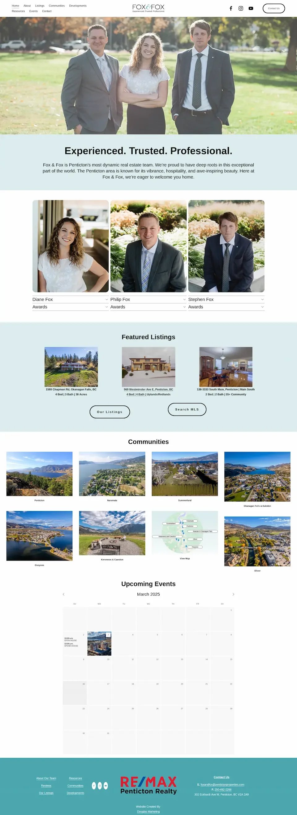 Website homepage for Fox & Fox real estate in Penticton featuring a header image of three professionally dressed people standing outdoors on a sunny day, smiling. Below, the page displays a section about experienced, trusted, professional agents with profiles of three agents: Diane, Philip, and Stephen Fox, along with their awards. There are featured listings of properties, a communities section showing images of local areas, and a March 2025 events calendar. The footer includes company contact information and branding for RE/MAX Penticton Realty.