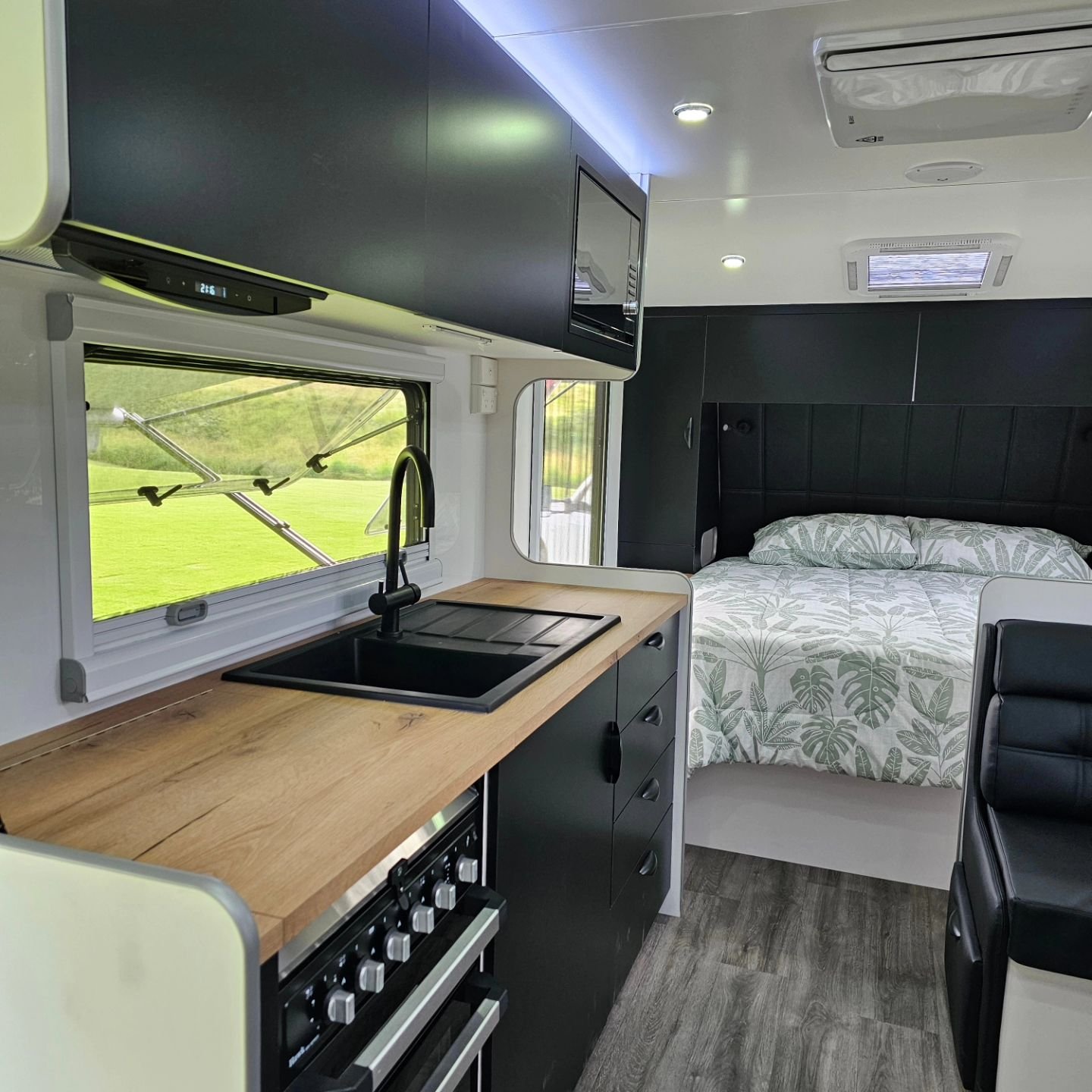 19.6 Rear door couples layout with cafe seating is a really comfortable size for 2 people. This layout provides a more private sleeping area, being a rear door and versatile seating space with a trifold table and still retaining the full separate ens
