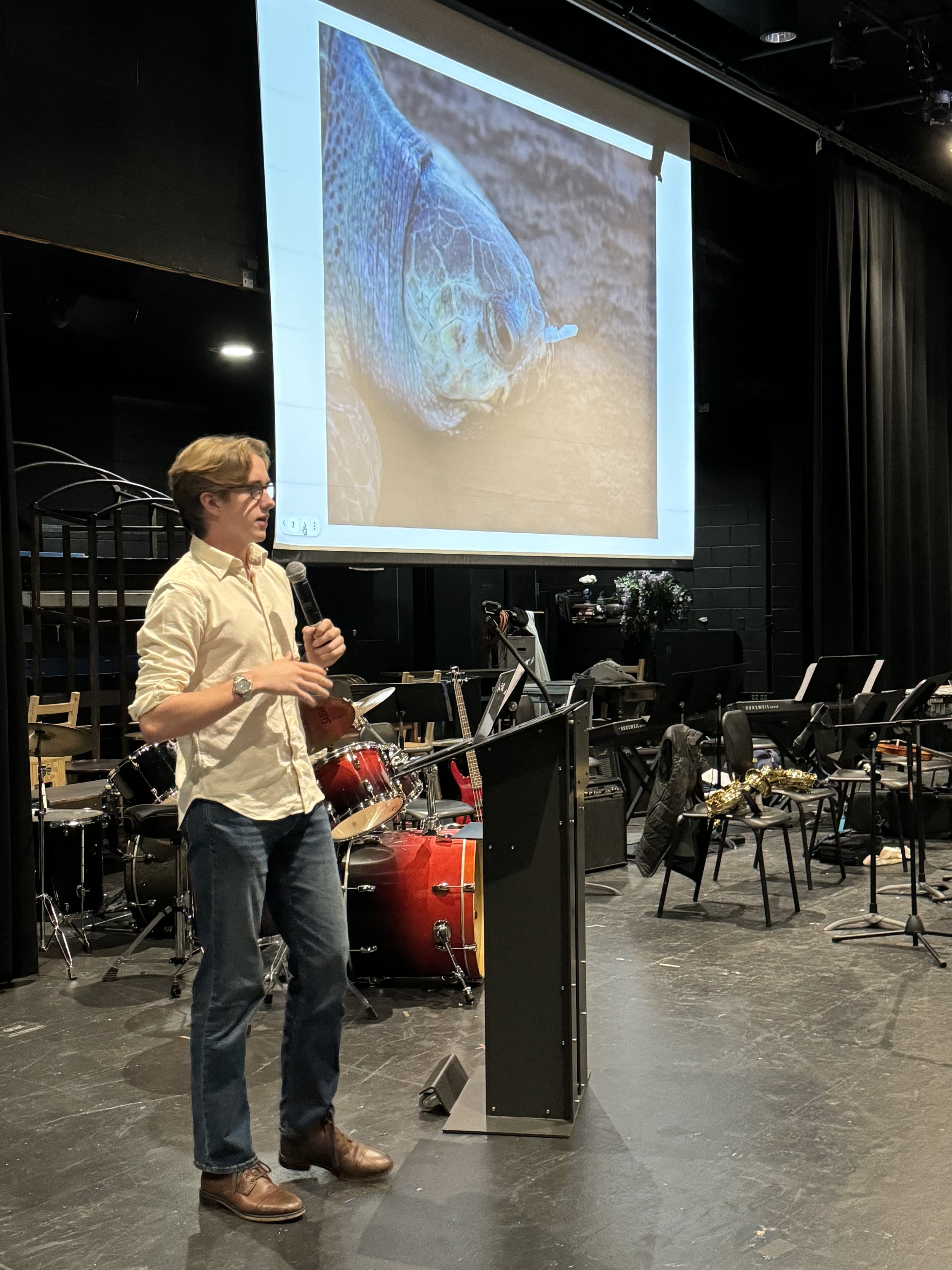 Grayson Houston-Henderson giving a presentation about the turtles