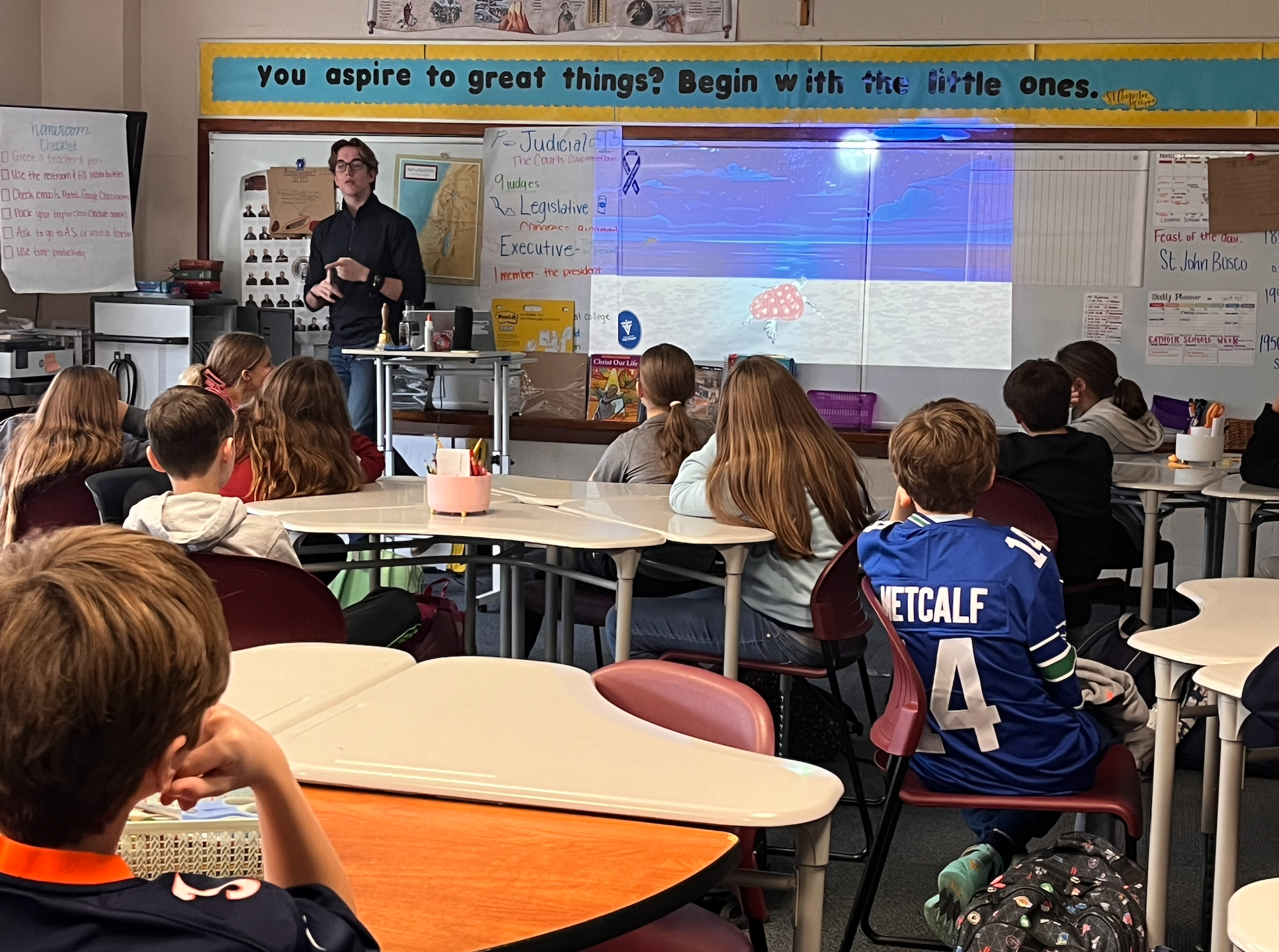 Grayson Houston-Henderson giving a presentation about the turtles
