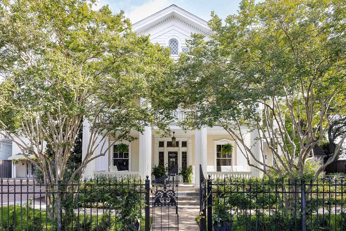 Historic white antebellum mansion surrounded by lush trees, the home of Preservation Houston, a Houston historic preservation education and advocacy nonprofit