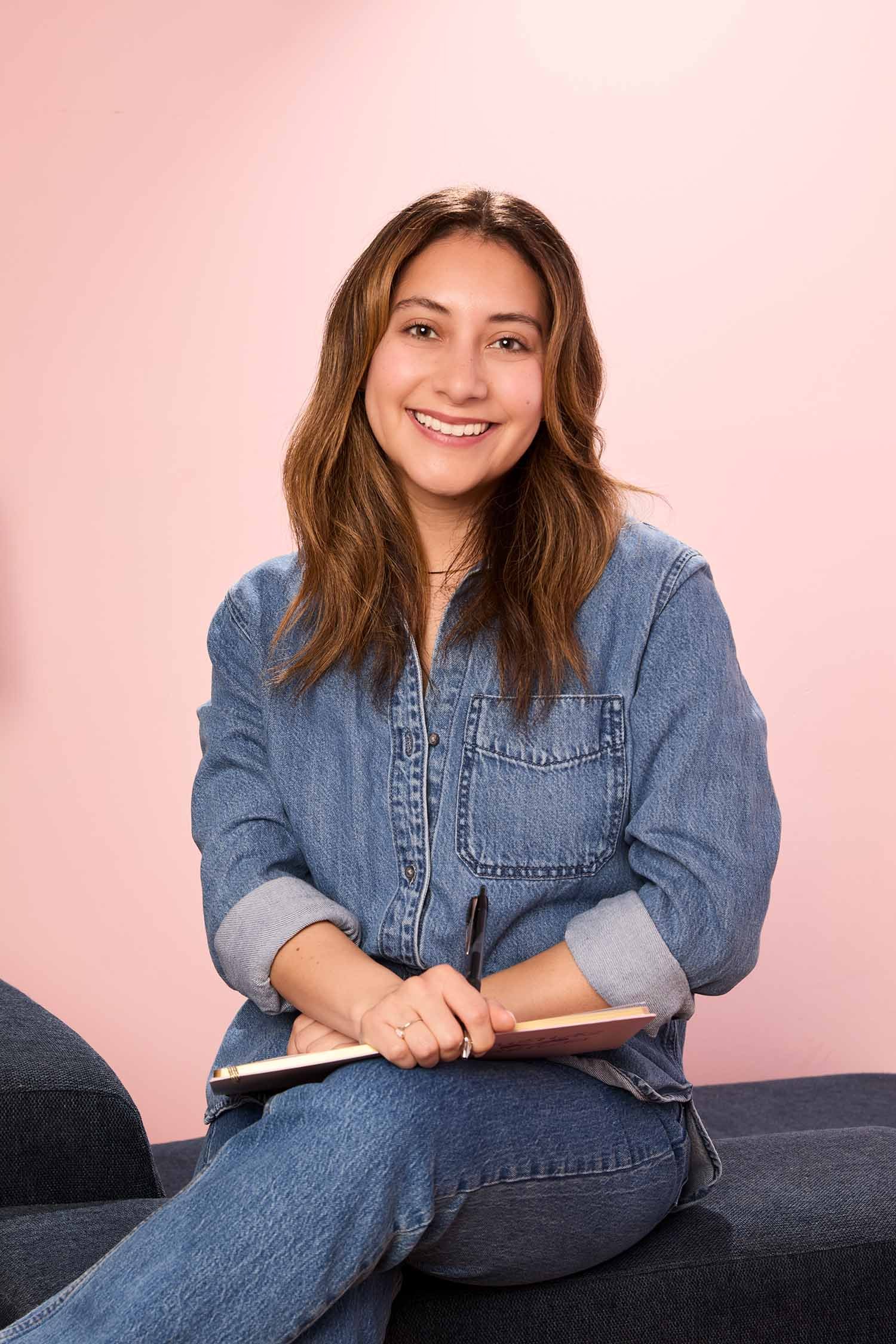Rosa Pruneda, Latina public relations consultant in Houston, smiling warmly in a professional studio headshot